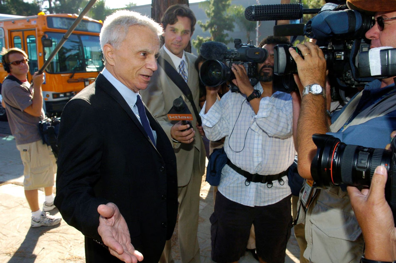 Actor Robert Blake speaks to reporters as he walks to Burbank Courthouse in Burbank, California, Aug. 29, 2005.