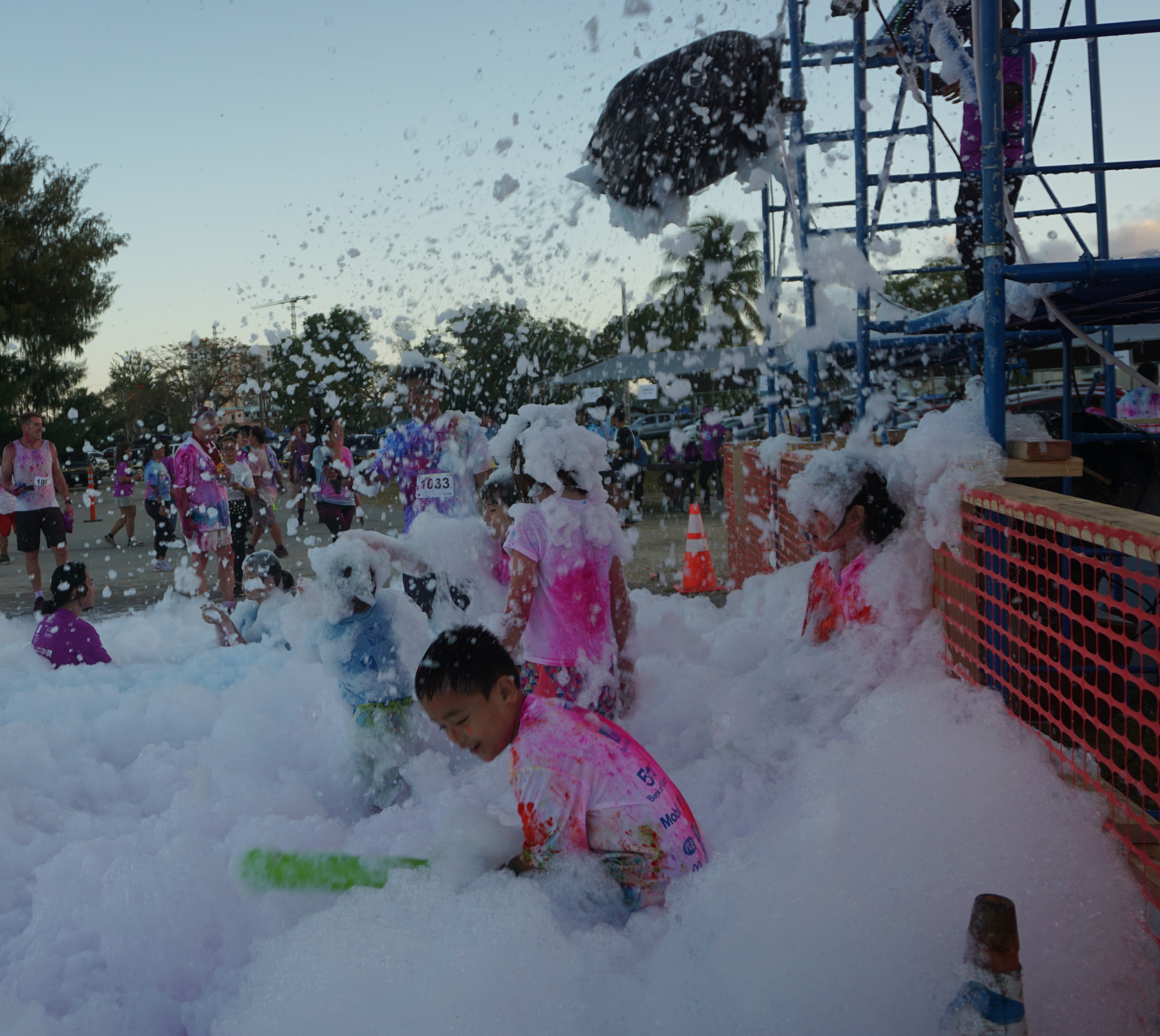 Kids play with the bubbles at the Garapan Fishing Base.