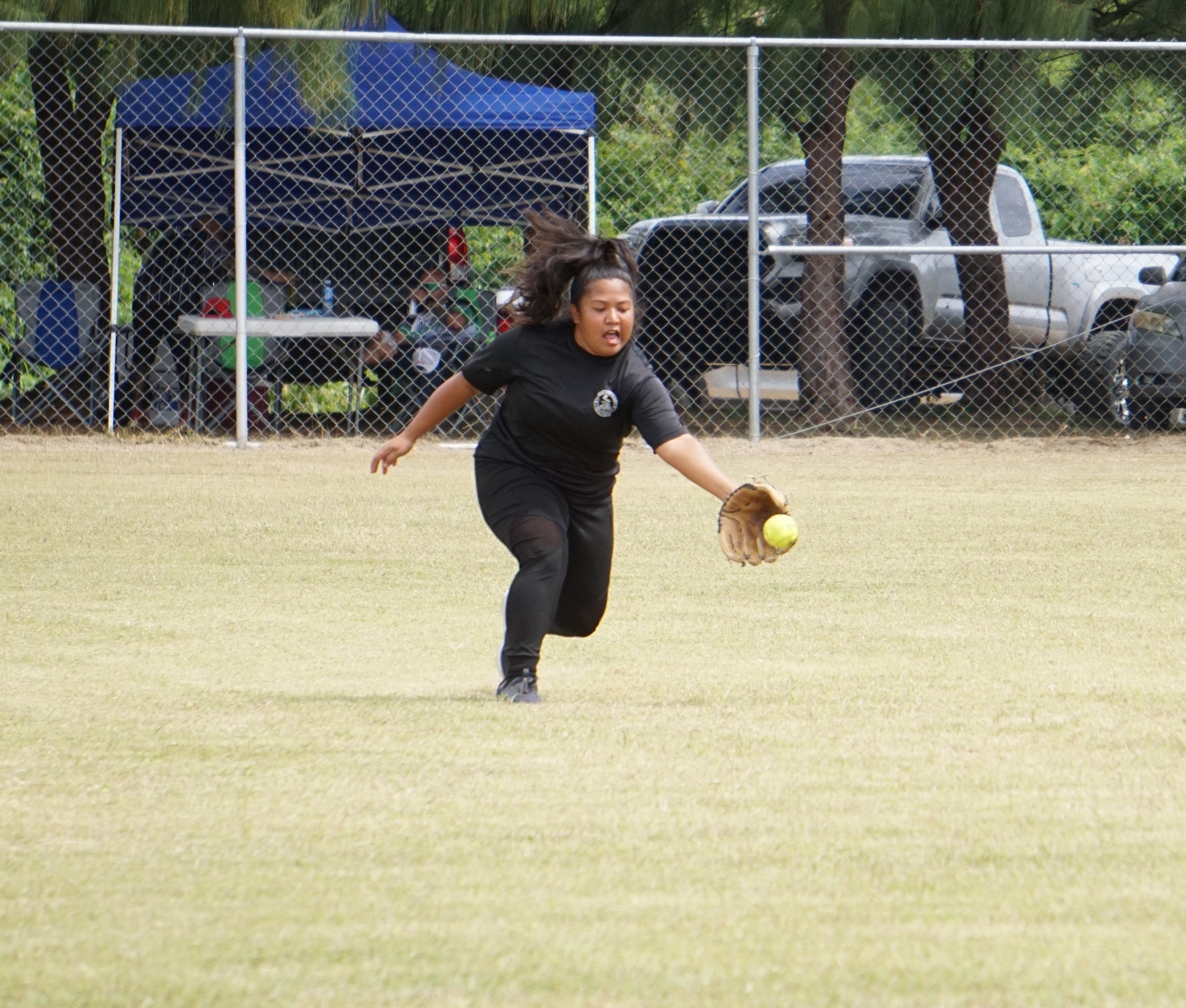Lady Sufa centerfielder Tonya Borja reaches out to catch the grounder during a ladies division game of the 2023 Budweiser Belau Amateur Softball League at the Dandan baseball field on Sunday.