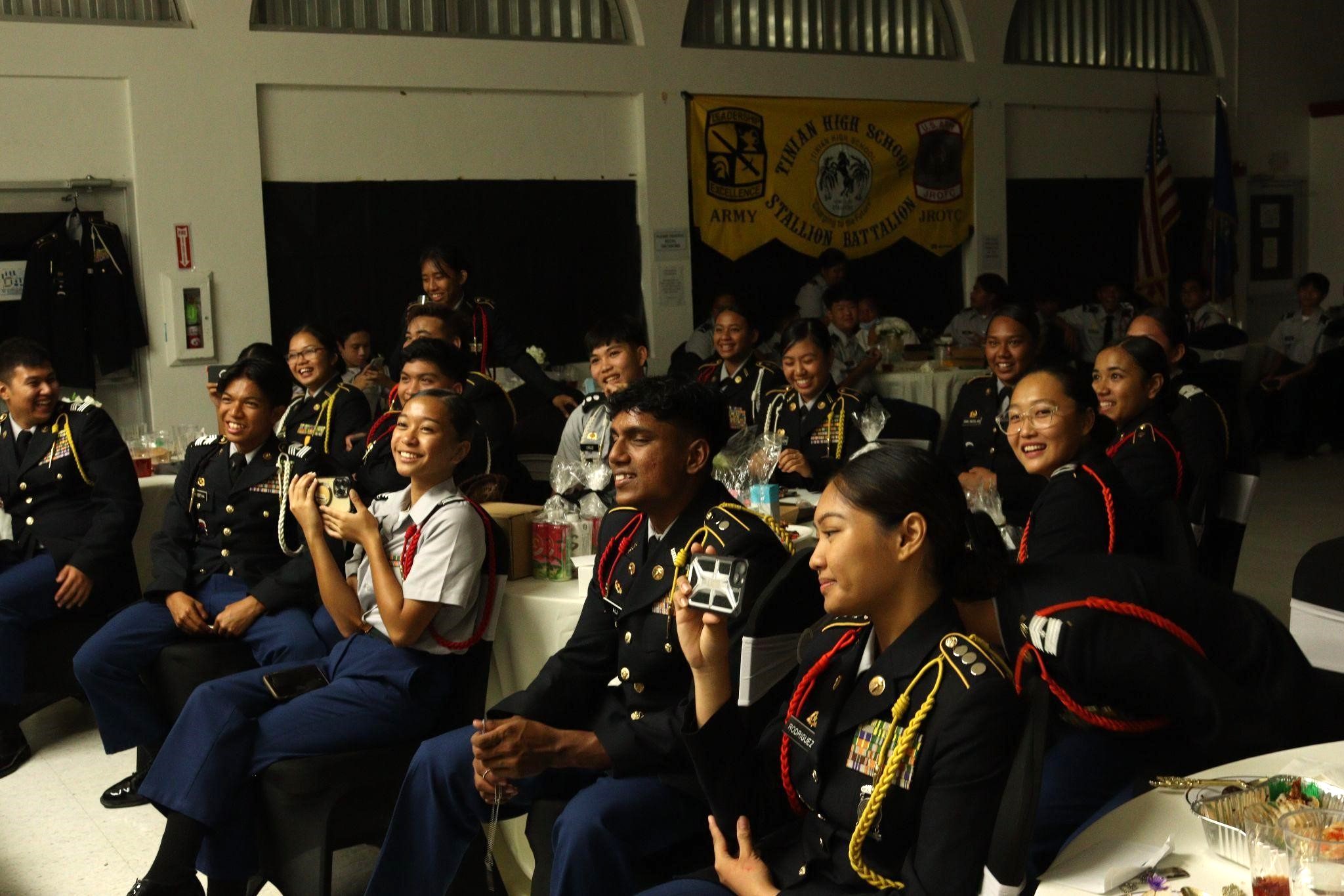 Attendees watch the performances on stage.