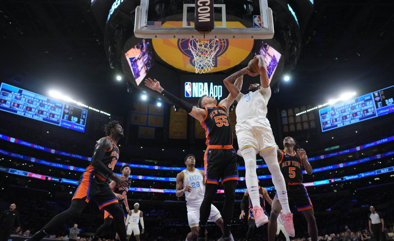 Los Angeles Lakers forward Anthony Davis (3) shoots the ball against New York Knicks center Isaiah Hartenstein (55) in the first half at Crypto.com Arena in Los Angeles, California, March 12, 2023.