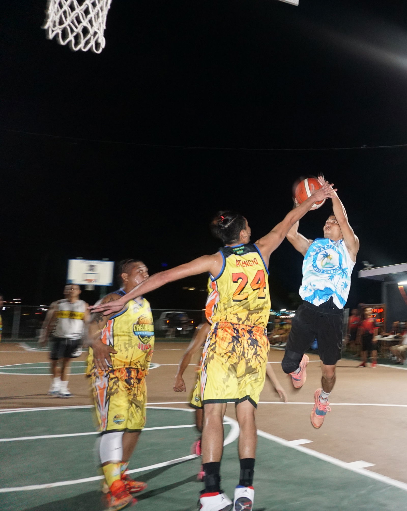 The Game's Joe Sablan takes the fadeaway jump shot over a defender during an open division game of the Saipan Centennial Lions Club Invitational Basketball League at the Civic Center basketball court on Wednesday.