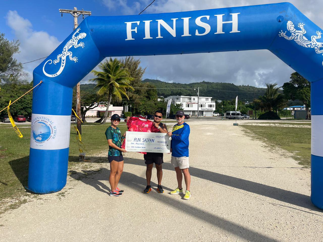 Jenna Kong, Run Saipan vice president and chair of the CHCC Sunshine Squad, with Run Saipan President Edward Dela Cruz Jr., center, and Secretary & Treasurer Dr. Ron Snyder. The CNMI Sunshine Squad donated $1,000 to Run Saipan.