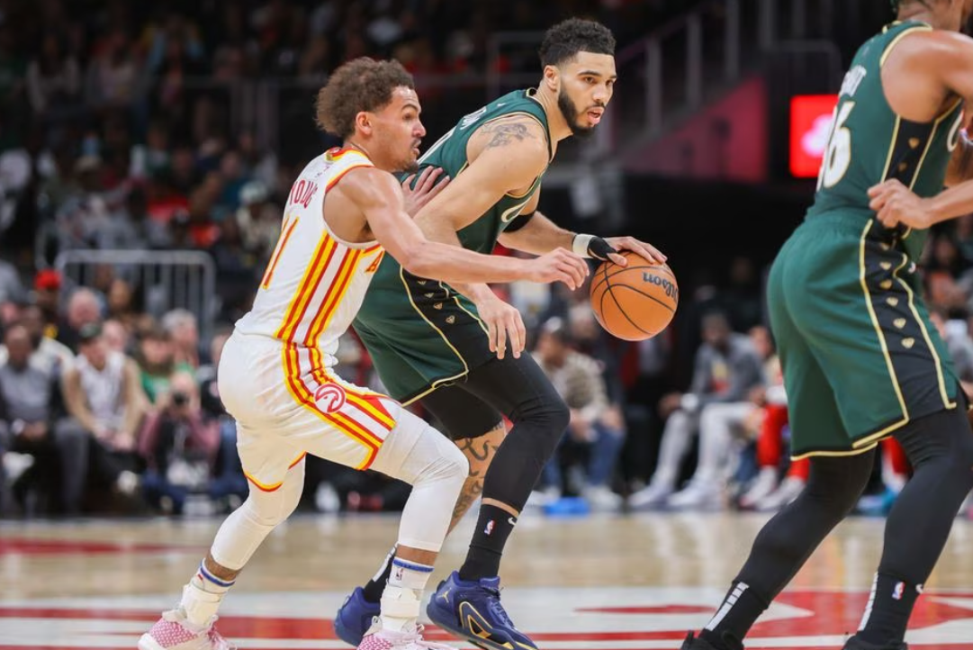 Boston Celtics forward Jayson Tatum (0) is defended by Atlanta Hawks guard Trae Young (11) in the second quarter at State Farm Arena in Atlanta, Georgia, March 11, 2023.