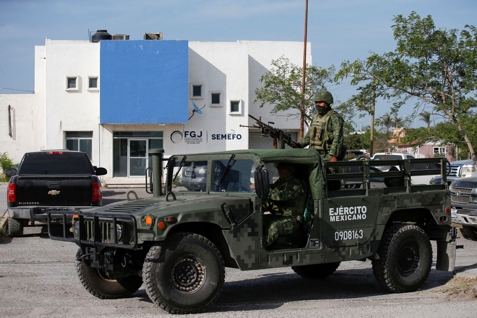Soldiers stand guard outside the Forensic Medical Service morgue building, after authorities found the bodies of two of four Americans kidnapped by gunmen, in Matamoros, Mexico, March 7, 2023.
