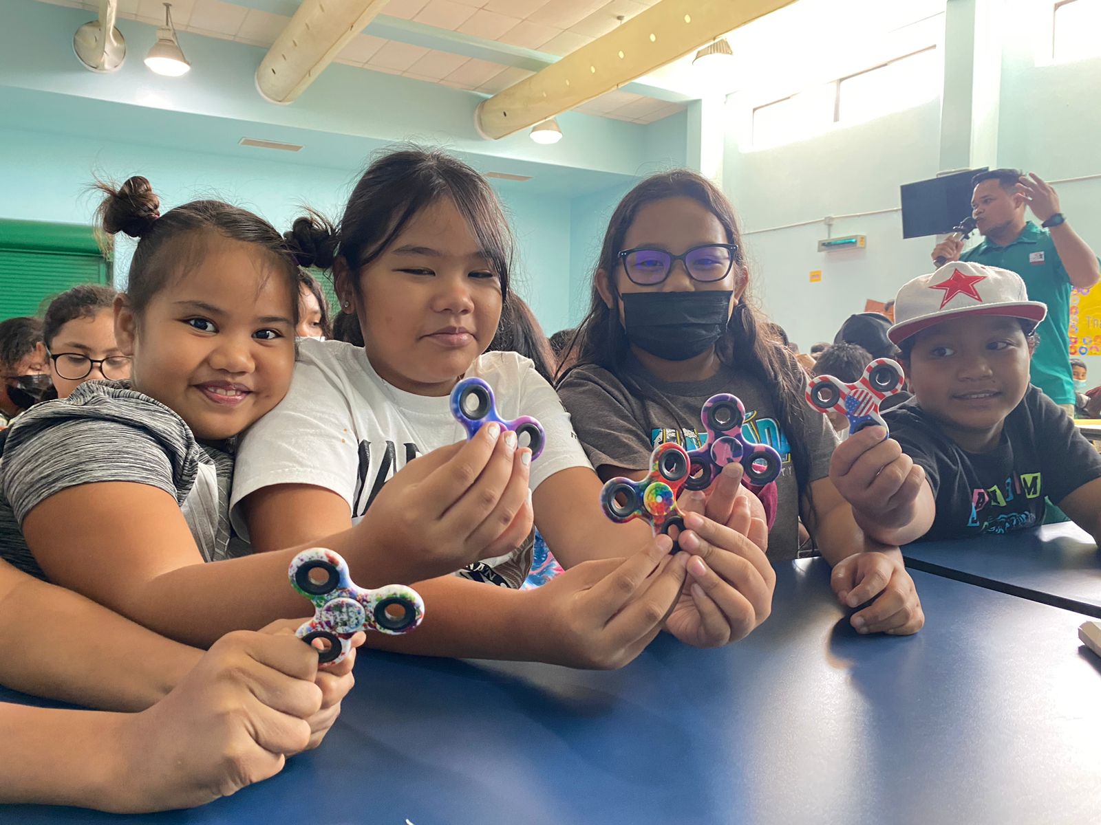 From left,  Derrisa Asao,  Aliyah  Sablan, Josalyn San Nicolas, and  Marcellus Mangartin  of  Kagman Elementary show off their tourism turners during the educational outreach of Marianas Tourism Education Council and Marianas Visitors Authority on March 8, 2023, at their school in Saipan.