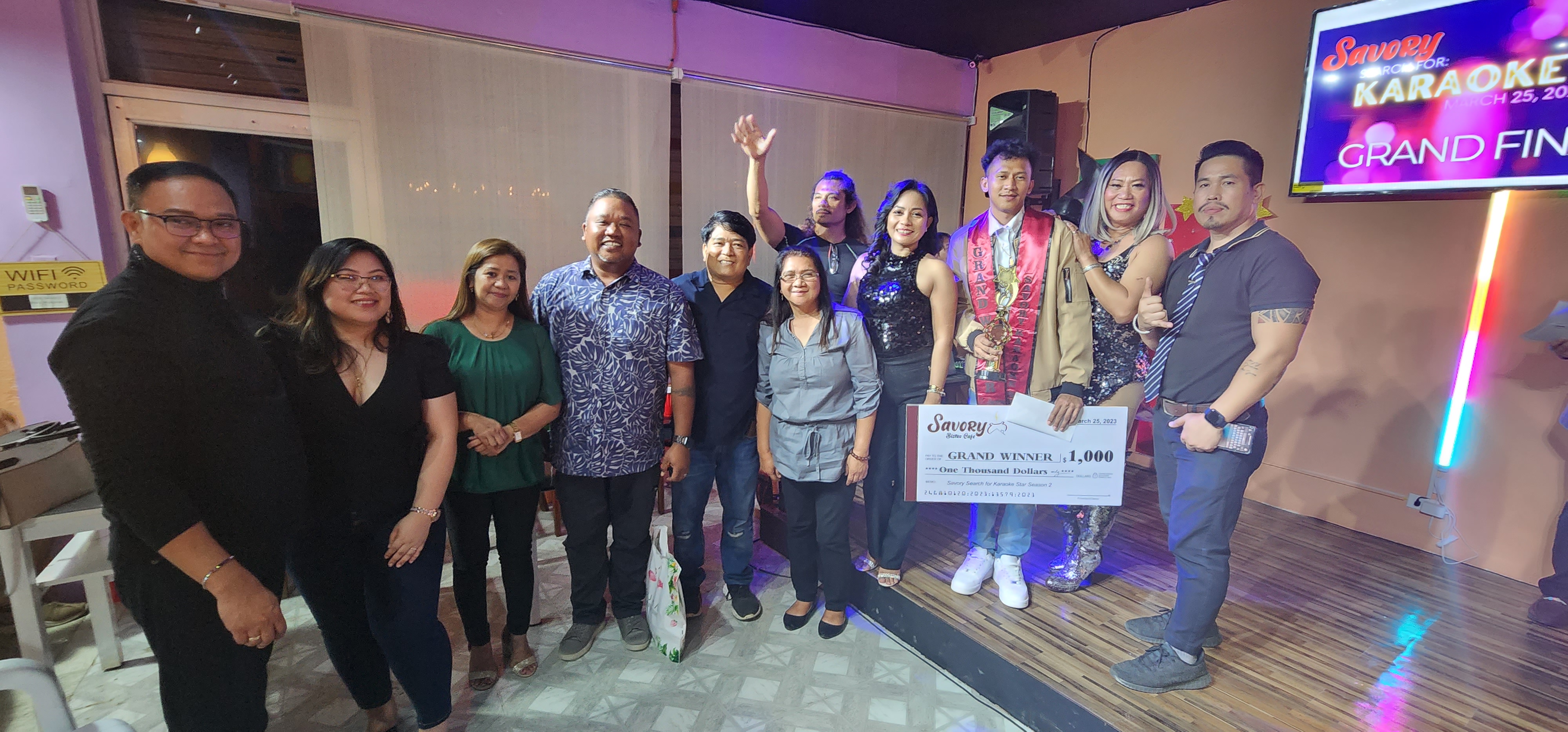 Karaoke Star Alfred Tabora with Savory's management and competition judges.
