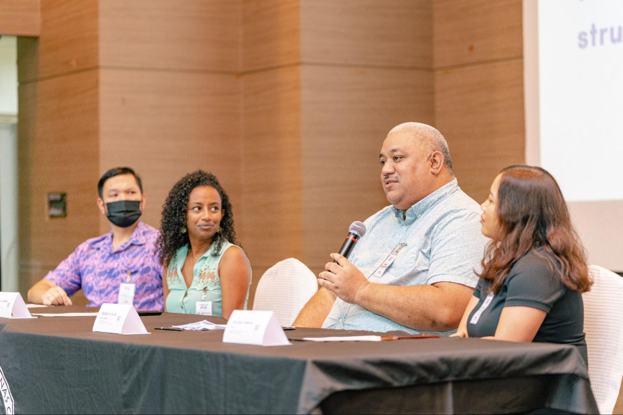 Community Guidance Center Prevention Specialist Fredrick “Fred” Fatialofa addresses the participants during a panel discussion with NMC Associate Professor Dr. Beylul Solomon, NMC Assistant Professor Jesse Pangelinan, and Project PROA director Kaelani Demapan.