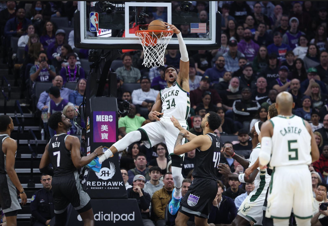 Milwaukee Bucks power forward Giannis Antetokounmpo (34) dunks the ball above Sacramento Kings center Trey Lyles (41) during the first quarter at Golden 1 Center in Sacramento, California, March 13, 2023.