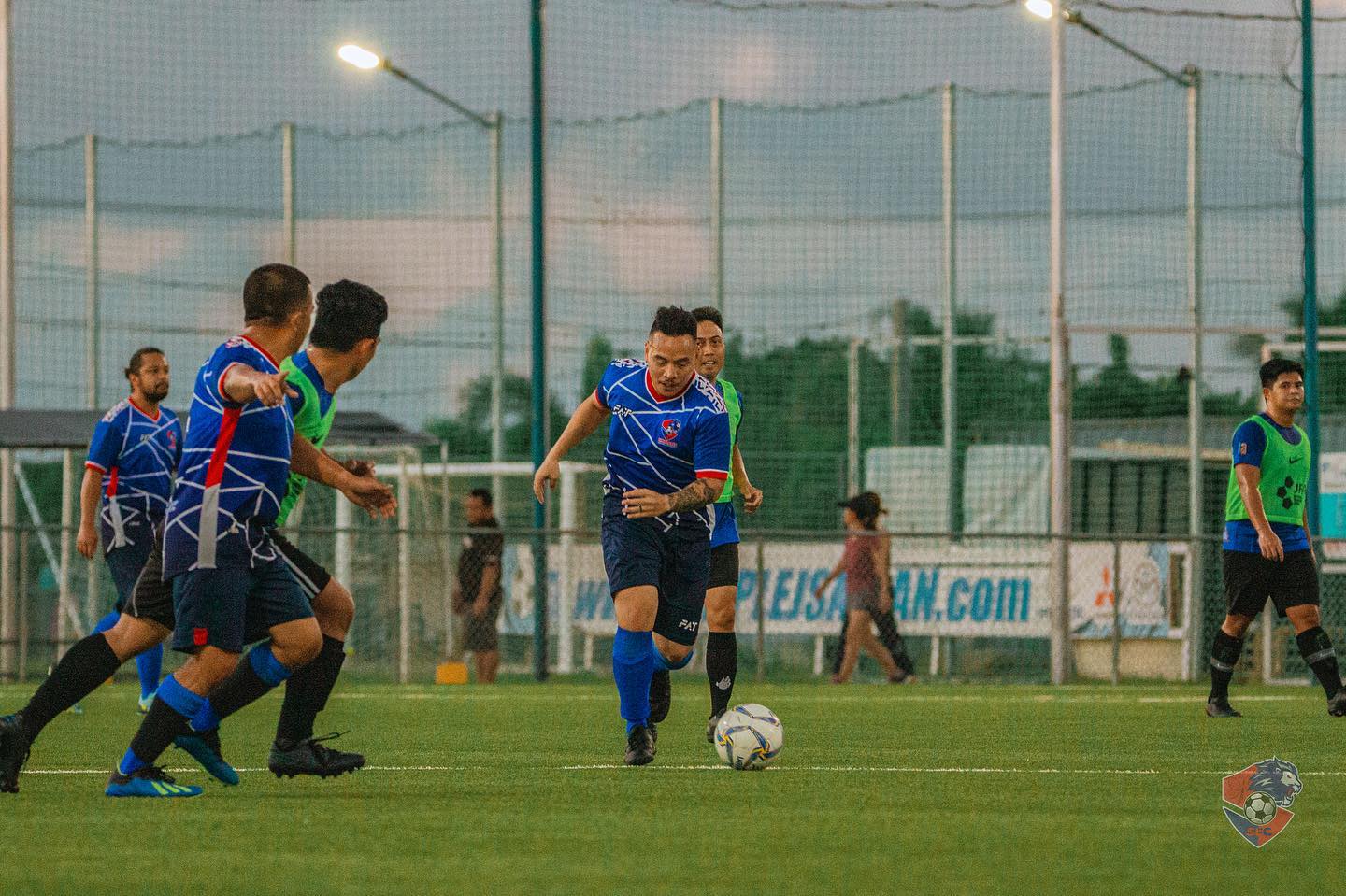 A Shirley's Football Club 2 player dribbles past defenders to set up a play during a Marianas Soccer League 2 game  at the NMI Soccer Training Center in Koblerville.