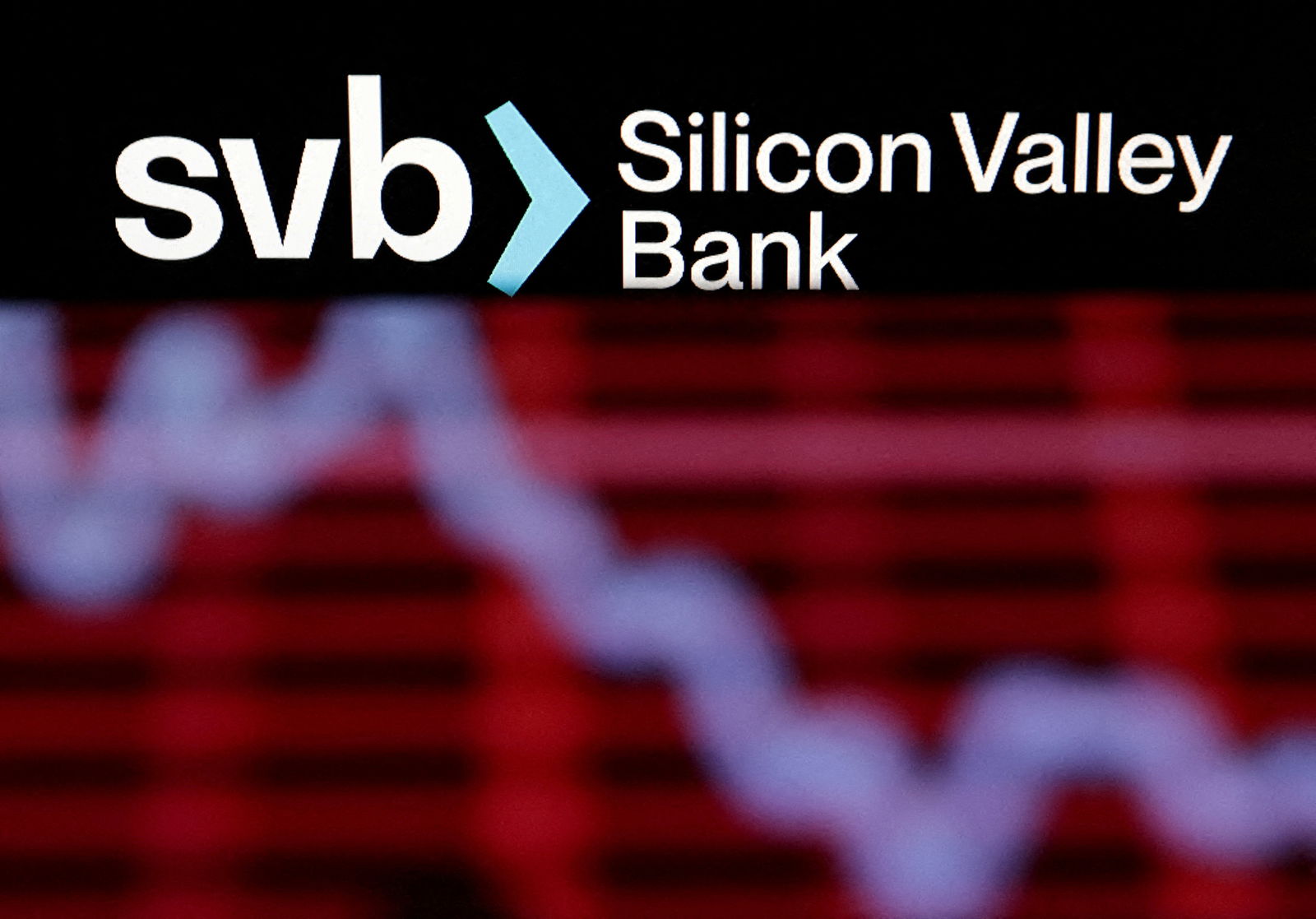Silicon Valley Bank logo and decreasing stock graph are seen in this illustration taken March 19, 2023.