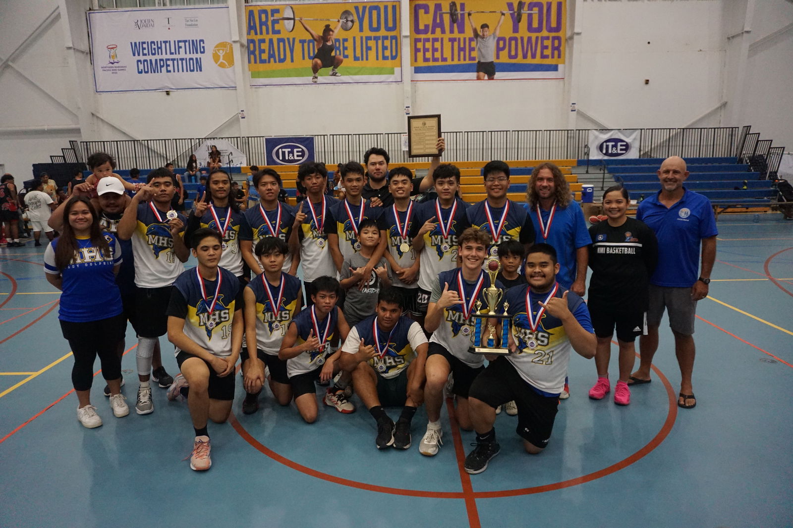 The MHS team members pose with the boys division championship trophy during the awards ceremony of the IT&E Interscholastic Basketball League at the MHS gym on Saturday.