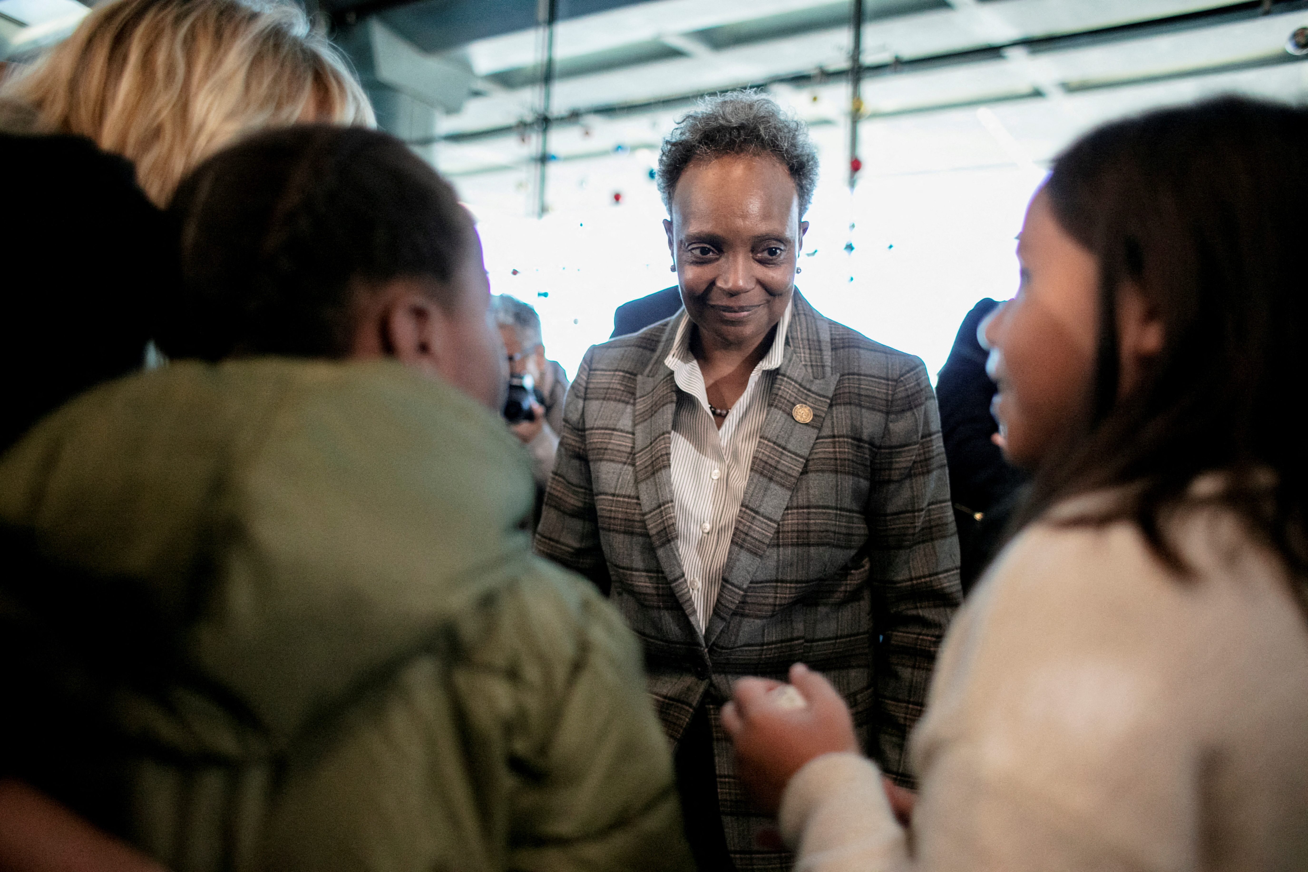 Chicago Mayor Lori Lightfoot speaks to children after a press event ahead of expected Thanksgiving travel at O'Hare airport in Chicago, Illinois, Nov. 21, 2022.