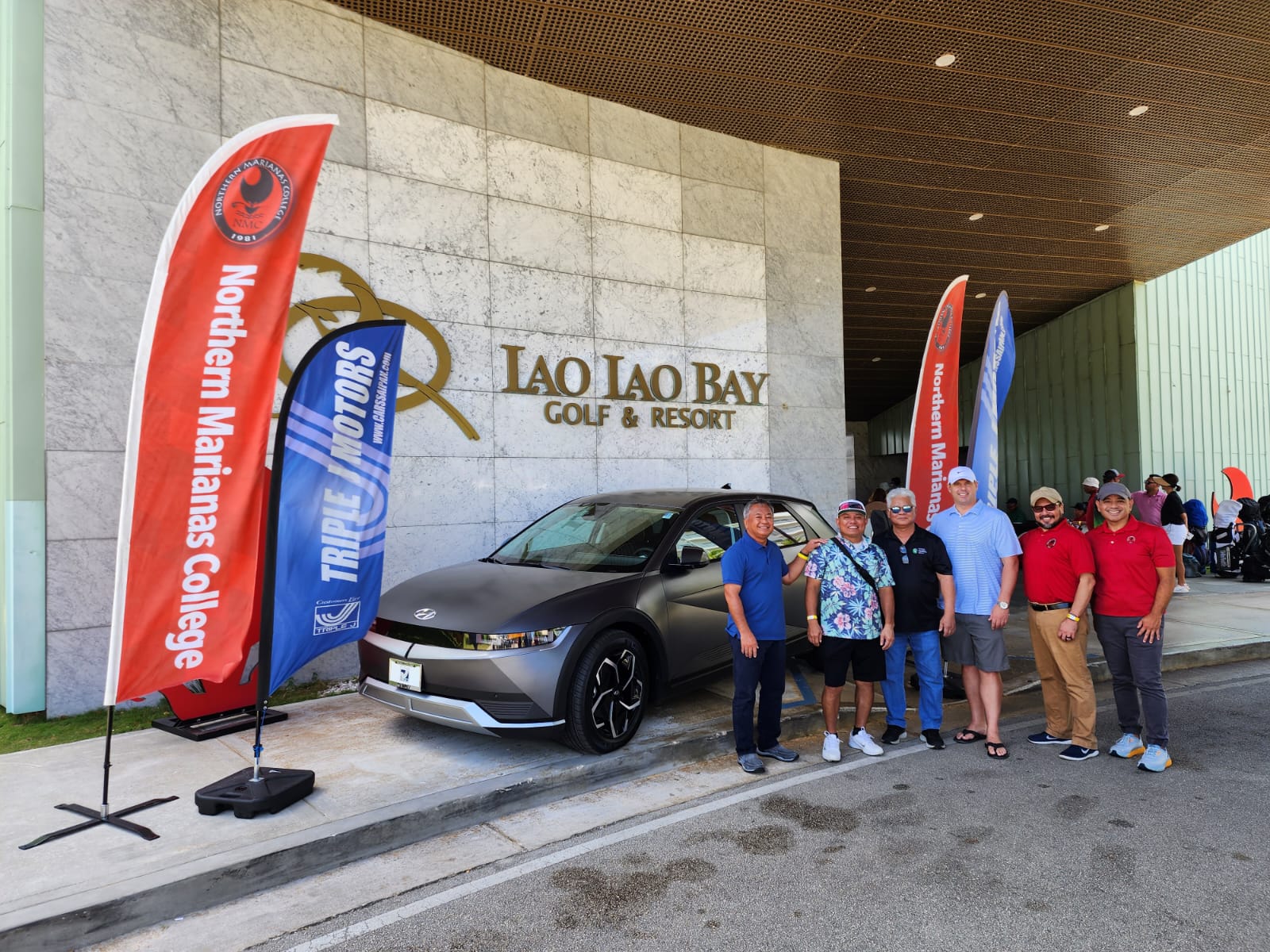 John Terlaje, second left, poses with the brand new 2023 Hyundai IONIQ 5 SEL he won for making a hole in one during the NMC Golf Open at Laolao Bay Golf & Resort on Saturday. Also in photo are Triple J Vice President for Finance & Administration Michael Sablan, Gov. Arnold I. Palacios, Triple J Motors General Manager Sean Ficke, Northern Marianas College President Galvin Deleon Guerrero, EdD, and NMC Vice President for Administration and Advancement Frankie Eliptico.