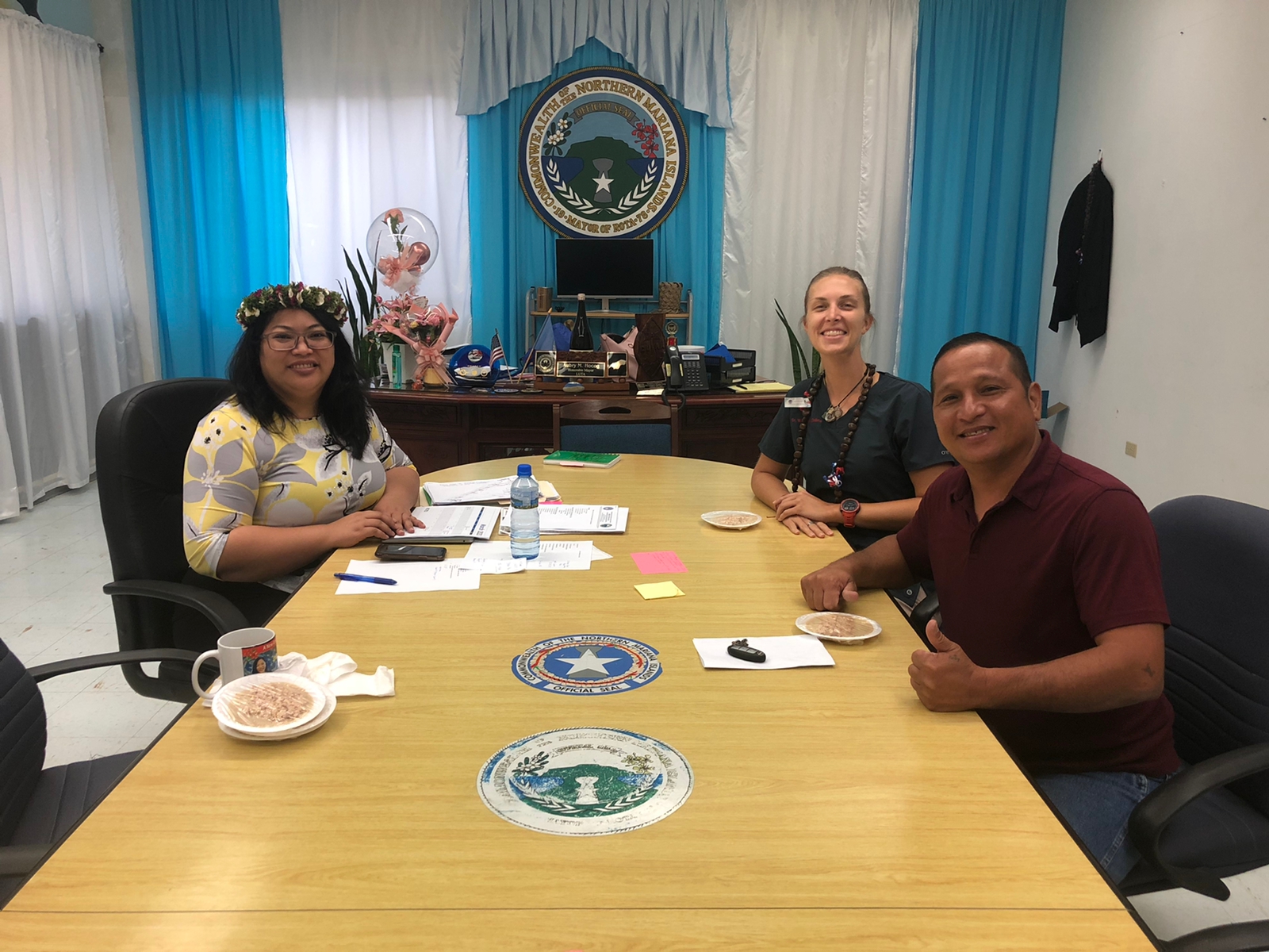 Rota Mayor Aubry Hocog, left, and Rota Municipal Council Chair Jim Atalig with veterinarian Whitney Collins.