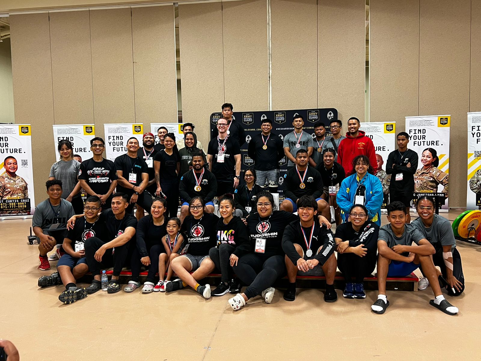 NMI weightlifters pose for a photo with the other participants of  the Olympic Weightlifting Championships at the Barrigada Readiness Center on Guam Saturday.