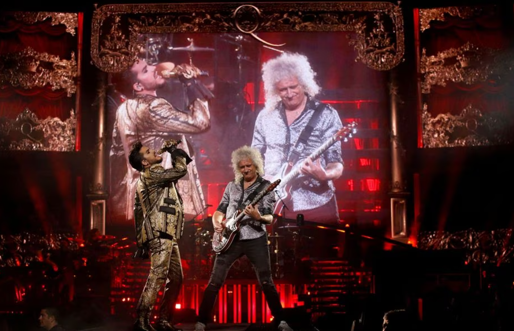 Guitarist Brian May of Queen and singer Adam Lambert perform during The Rhapsody Tour at The Forum in Inglewood, California, July 19, 2019.