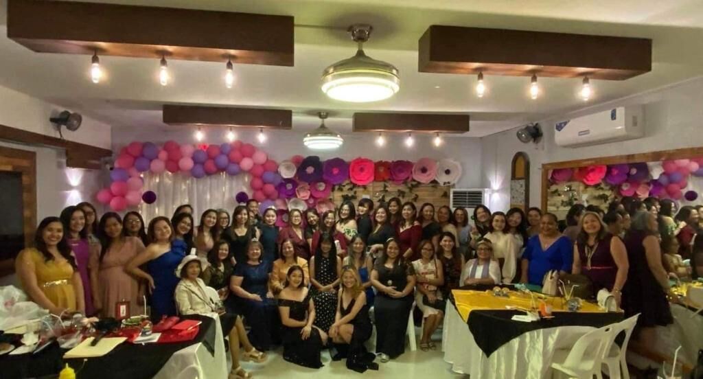 Members of the non-profit group, Abigail, pose for a photo during their Women’s Month celebration at Pepoy’s Café & Restaurant on March 18, 2023.