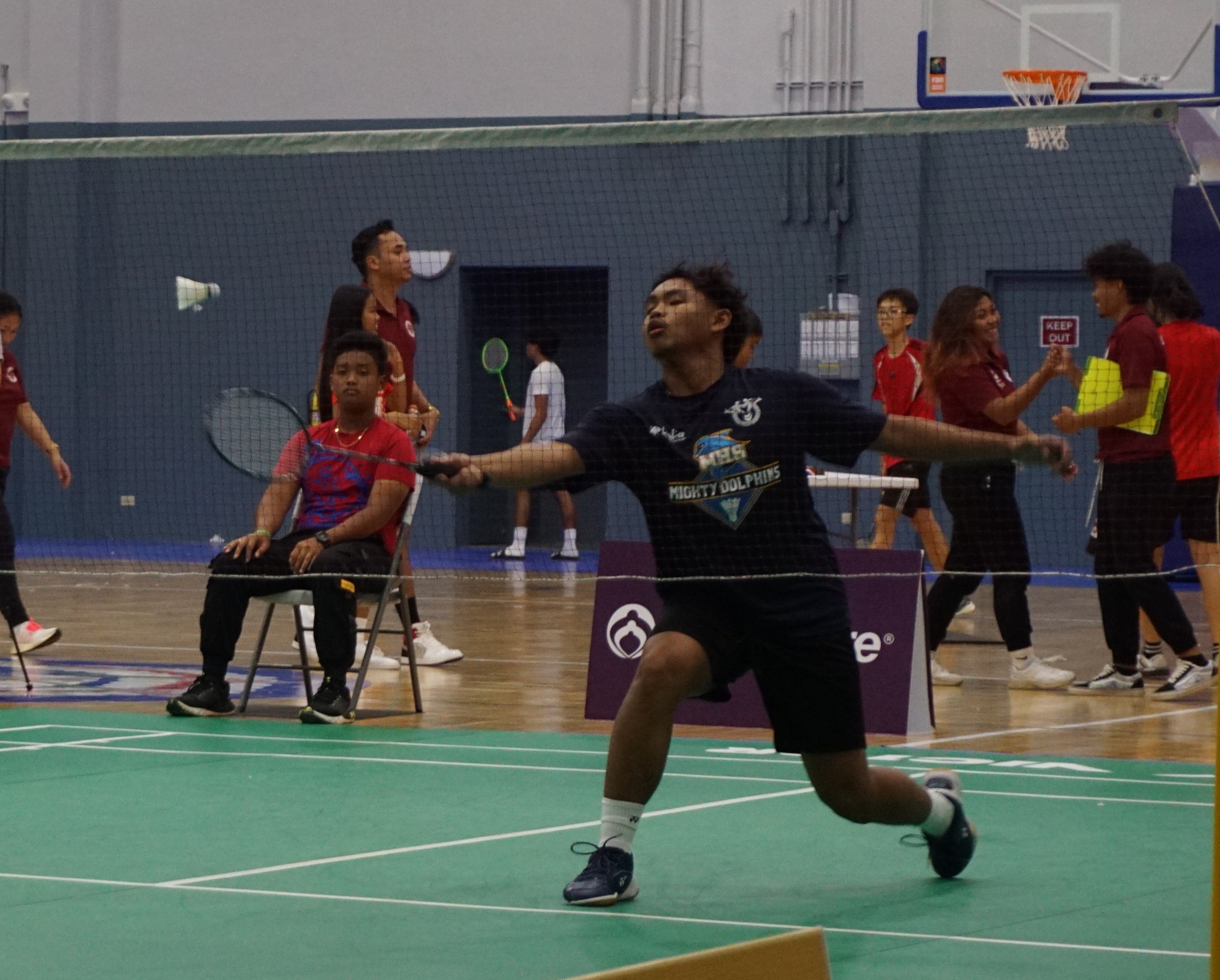 MHS 1's Brian Lubao attempts a net return.