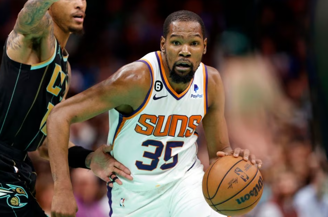 Phoenix Suns forward Kevin Durant (35) drives to the basket past Charlotte Hornets guard Kelly Oubre Jr. (12) during the second half at Spectrum Center Charlotte, North Carolina, March 1, 2023.
