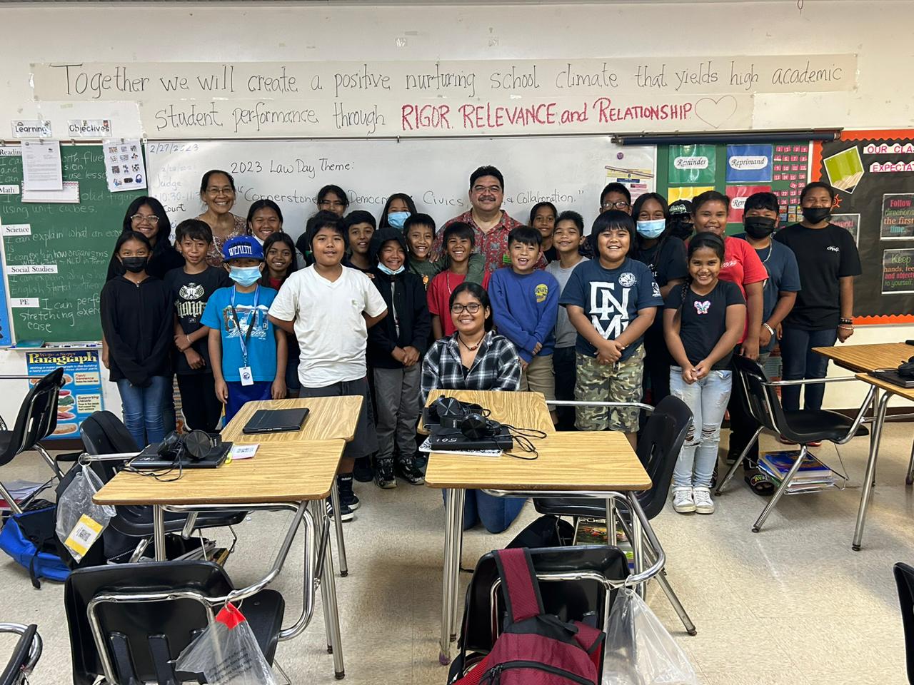 Judge Joseph N. Camacho poses with the fifth grade students at Kagman Elementary School and their teacher, Ms. Babauta.
