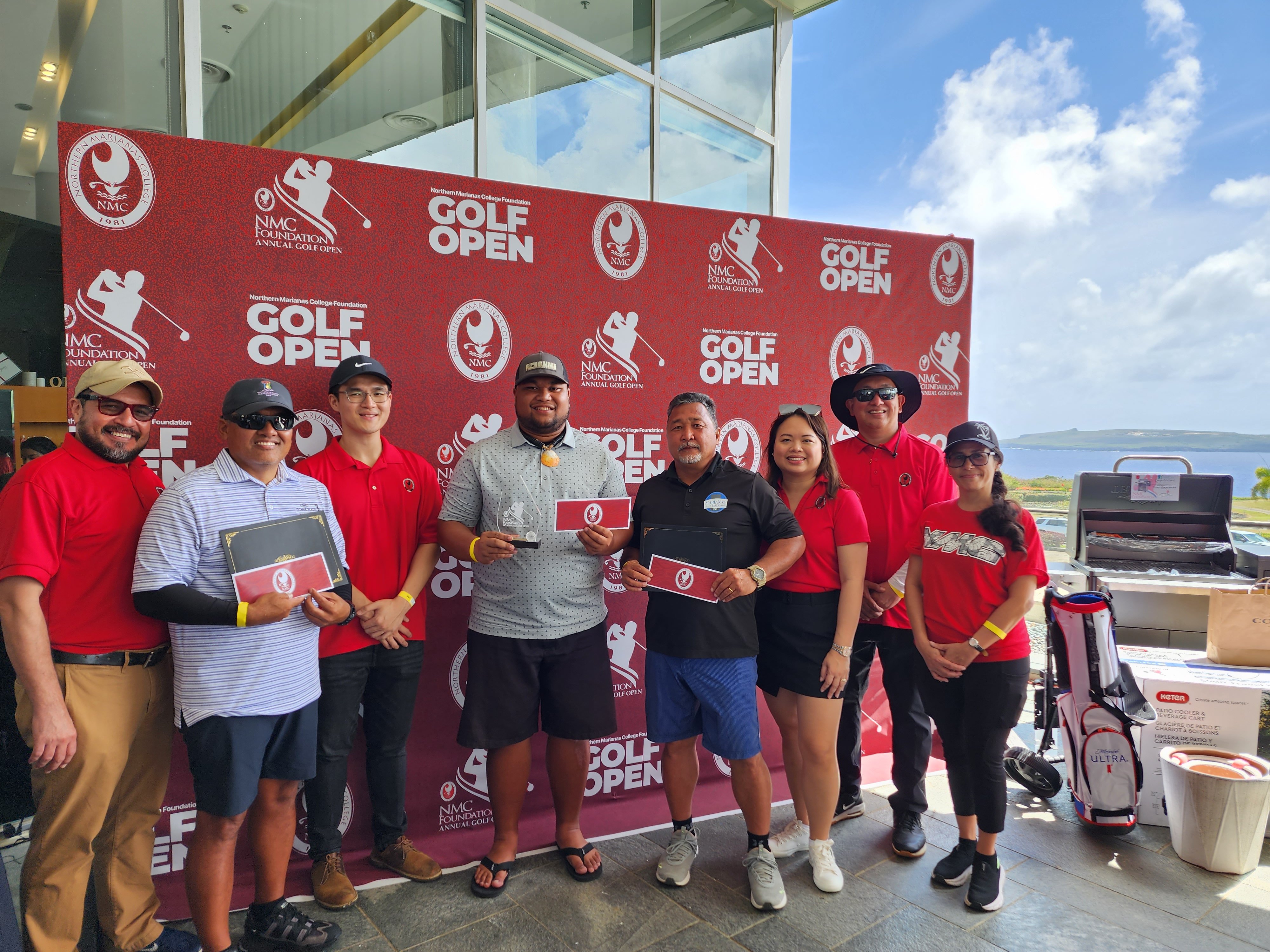 The top three B flight division players Darion Jones, Arvin Ogo, and Alexander Sablan pose with their prizes during the NMC Golf Open awards ceremony  at the LoaLao Bay Golf & Resort on Sunday.