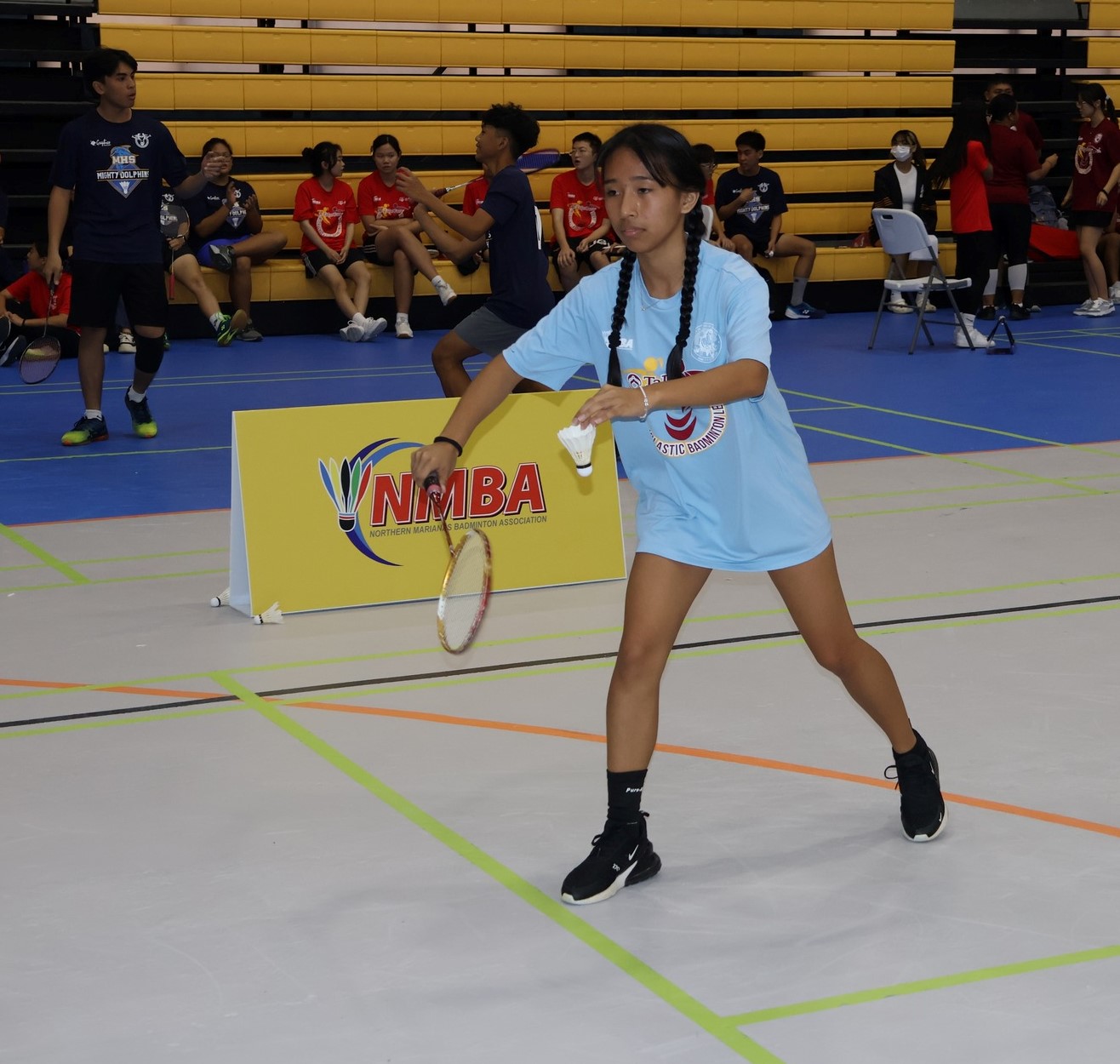 A Tinian High School player gets ready to serve during the TakeCare Interscholastic Badminton League last month.