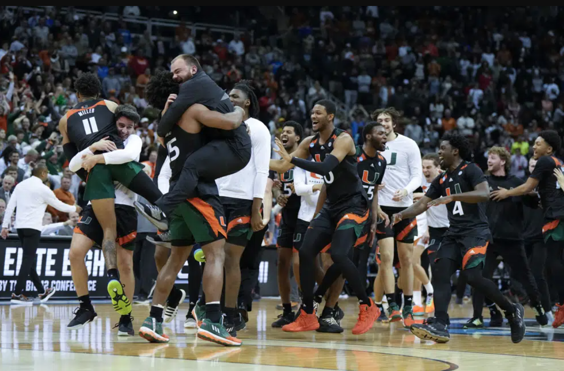 Miami celebrates after their win against Texas in an Elite 8 college basketball game in the Midwest Regional of the NCAA Tournament Sunday, March 26, 2023, in Kansas City, Mo