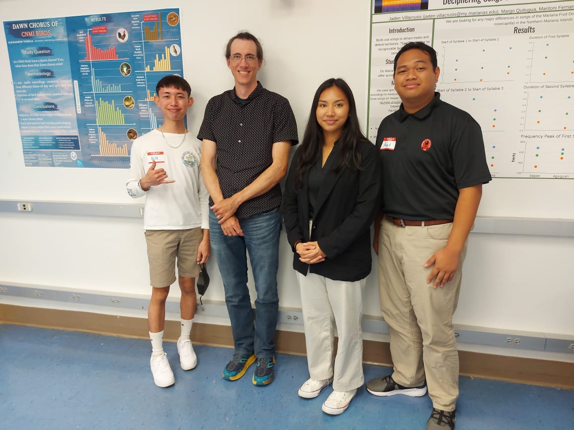 From left, NMC student Alexander Tudela, NMC Associate Professor Dr. Willson Gaul, and NMC students Jaden Villacrusis and Angel Santos at the Marianas Terrestrial Conservation Conference on Guam.