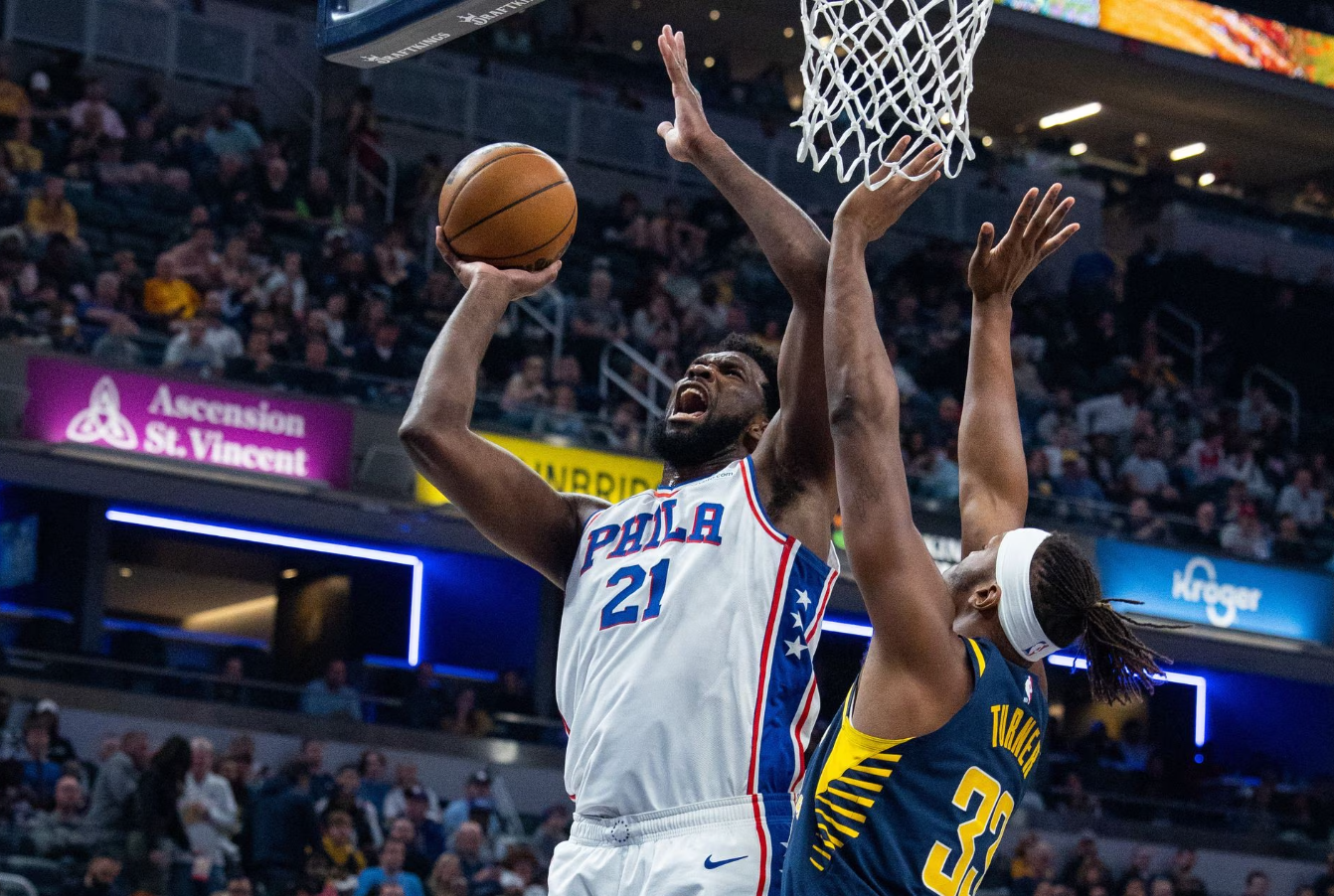 Philadelphia 76ers center Joel Embiid (21) shoots the ball while Indiana Pacers center Myles Turner (33) defends in the second half at Gainbridge Fieldhouse in Indianapolis, Indiana, March 6, 2023.