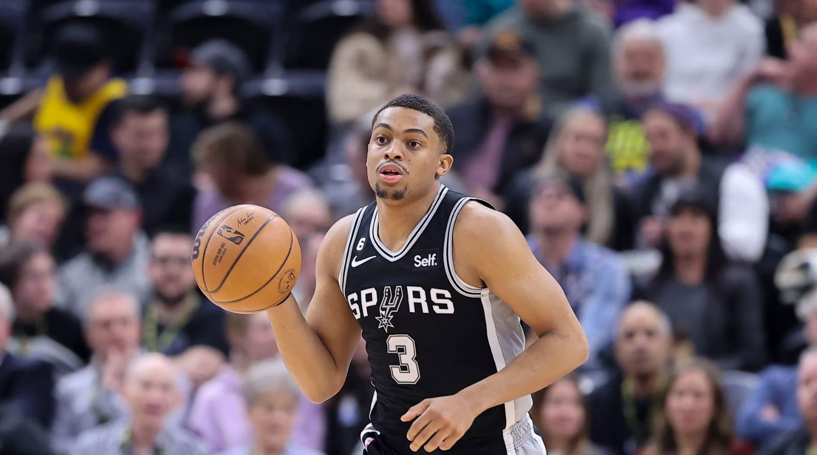 San Antonio Spurs forward Keldon Johnson (3) brings the ball up the court against the Utah Jazz in the first half at Vivint Arena in Salt Lake City, Utah, Feb. 28, 2023.