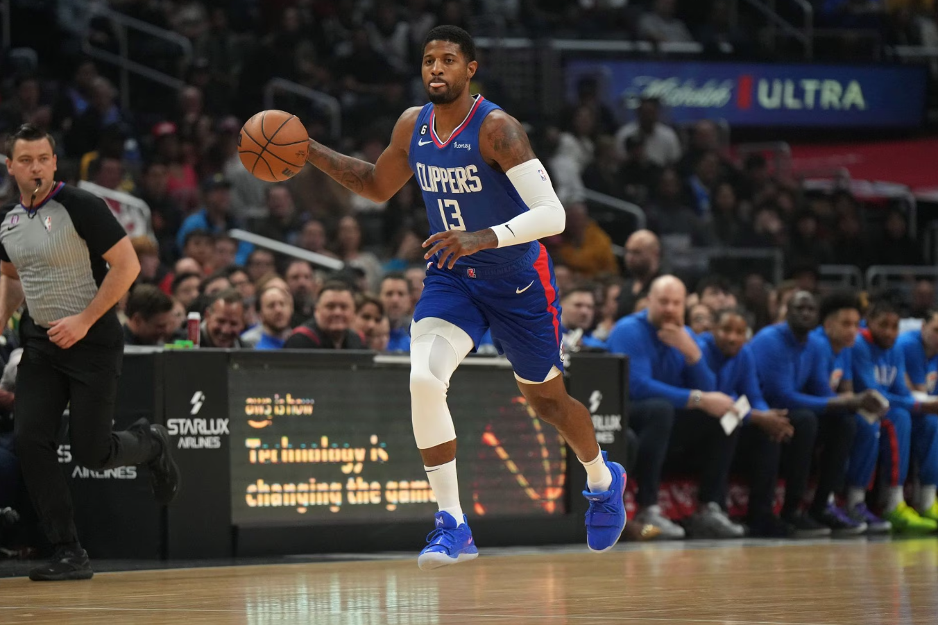 LA Clippers forward Paul George (13) dribbles the ball against the Oklahoma City Thunder in the first half at Crypto.com Arena in Los Angeles, California, March 21, 2023.