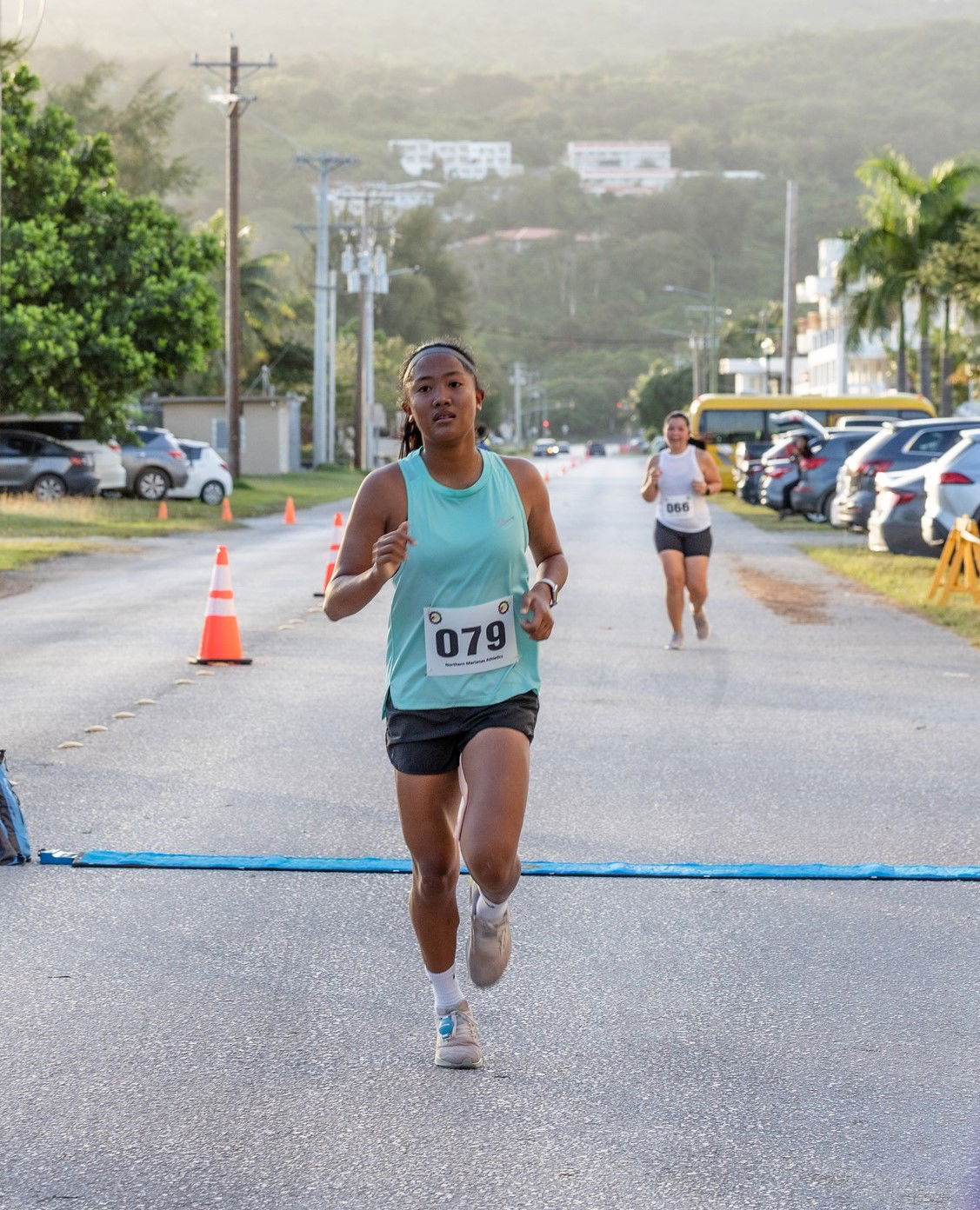 Kaithlyn Chavez pushes through for a third-place finish in the NMA NMI 10KM Women’s Run at American Memorial Park on Saturday.