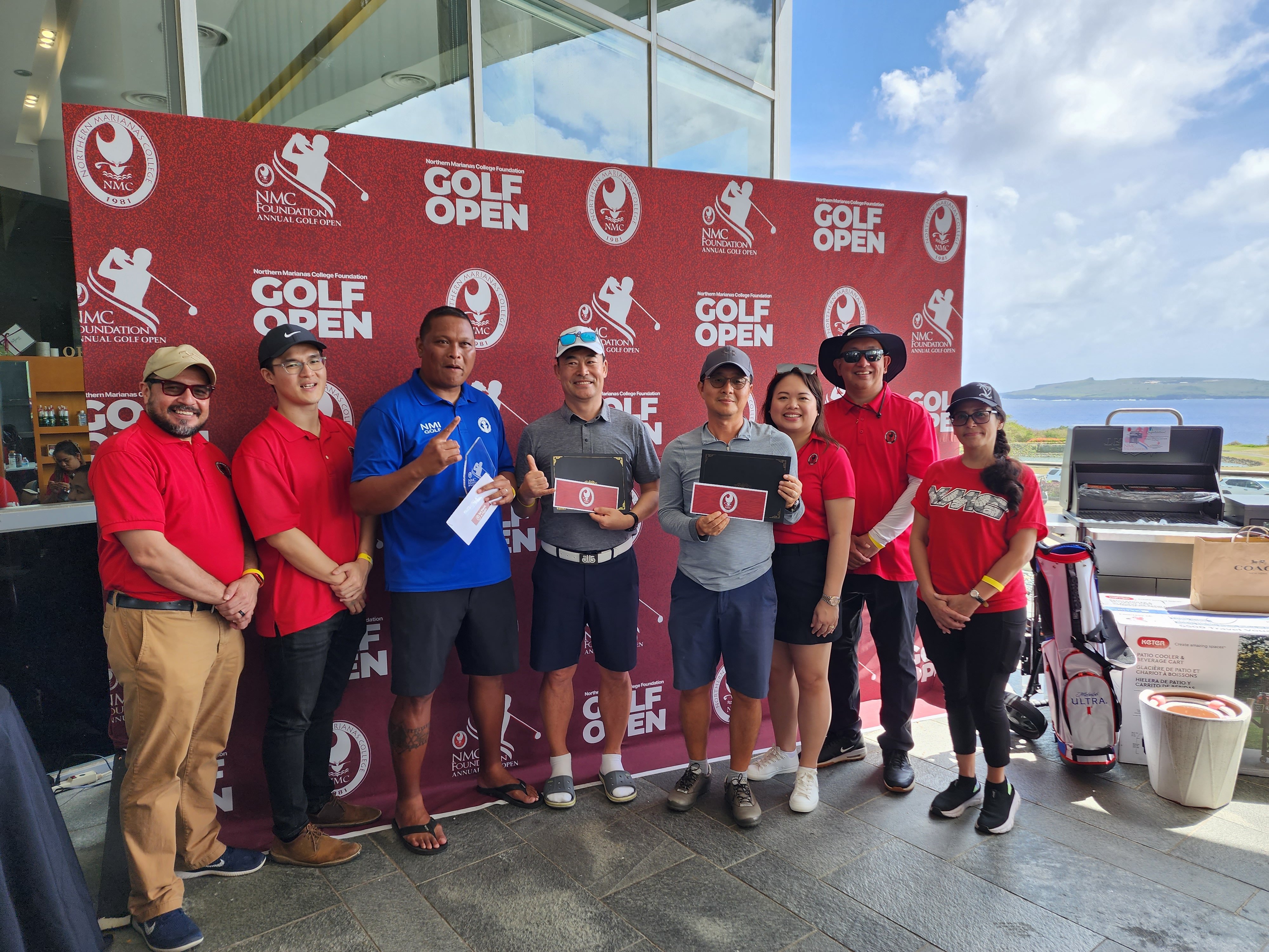 The top three A flight division players Ned Norita, Enoch Lim and Kiwan Nam pose with their prizes during the NMC Golf Open awards ceremony  at the LoaLao Bay Golf & Resort on Sunday.
