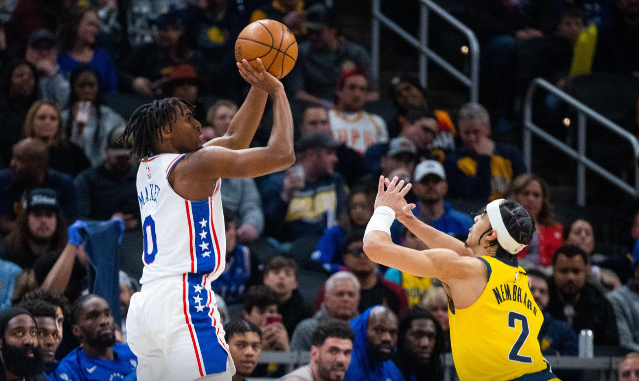 Philadelphia 76ers guard Tyrese Maxey (0) shoots the ball while Indiana Pacers guard Andrew Nembhard (2) defends in the second quarter at Gainbridge Fieldhous in Indianapolis, Indiana, March 18, 2023.