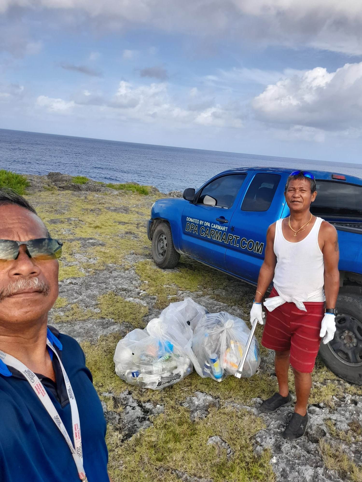  Max Aguon with another community volunteer, Rolly Quirijero, collected trash at Agingan Point in San Antonio on Sunday.