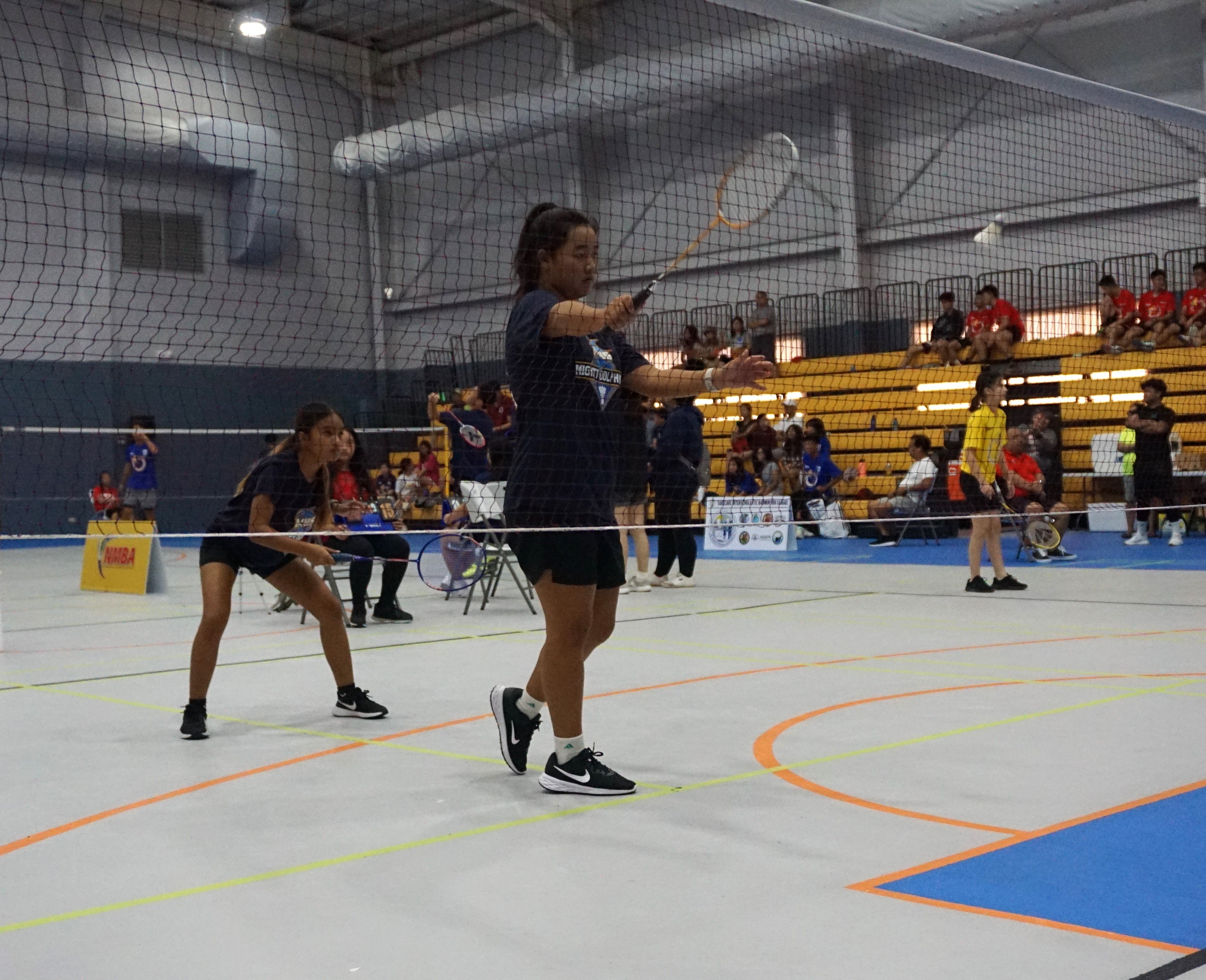 An MHS player serves against GCA during a girls doubles event of the TakeCare-PSS Interscholastic Badminton League at the Ada gym.