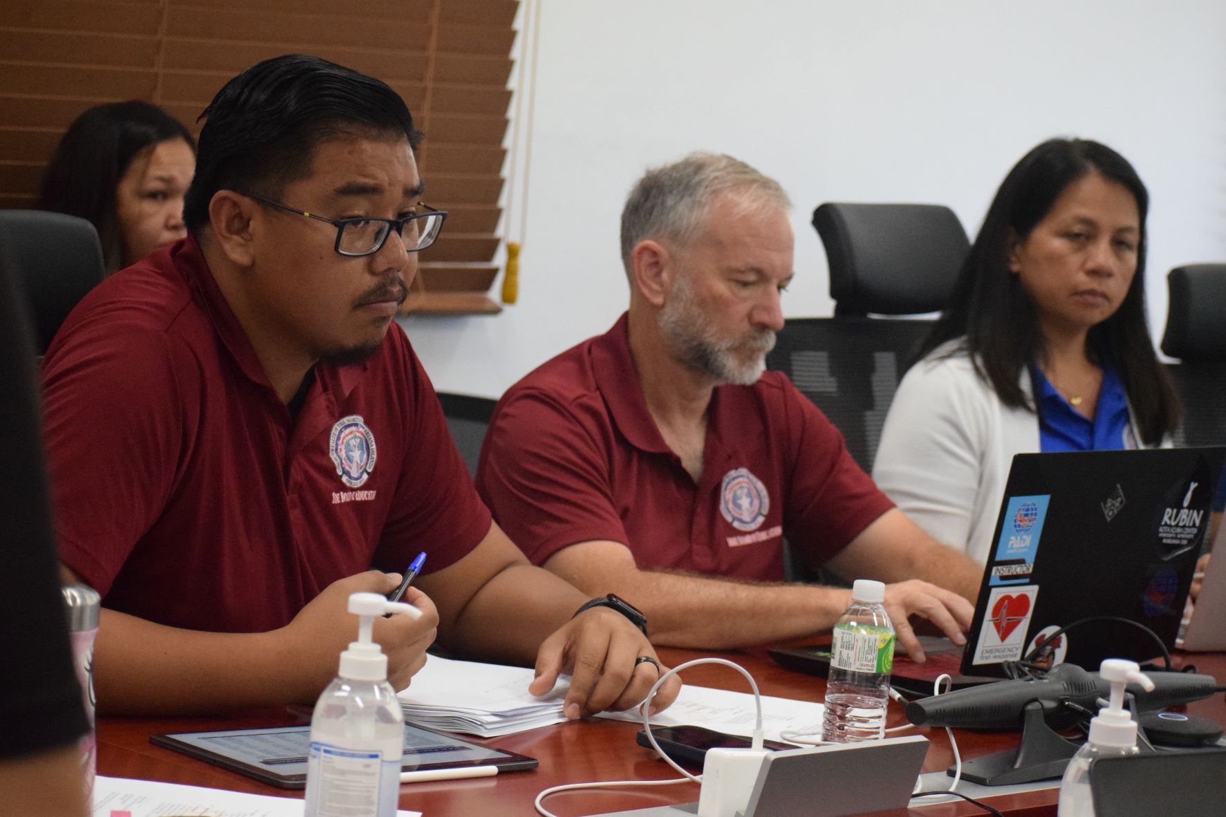 Newly elected Board of Education Chair Antonio L. Borja, left, presides over a meeting Thursday as non-public school representative Ronald Snyder, center, and board member Maisie B. Tenorio, right, listen.