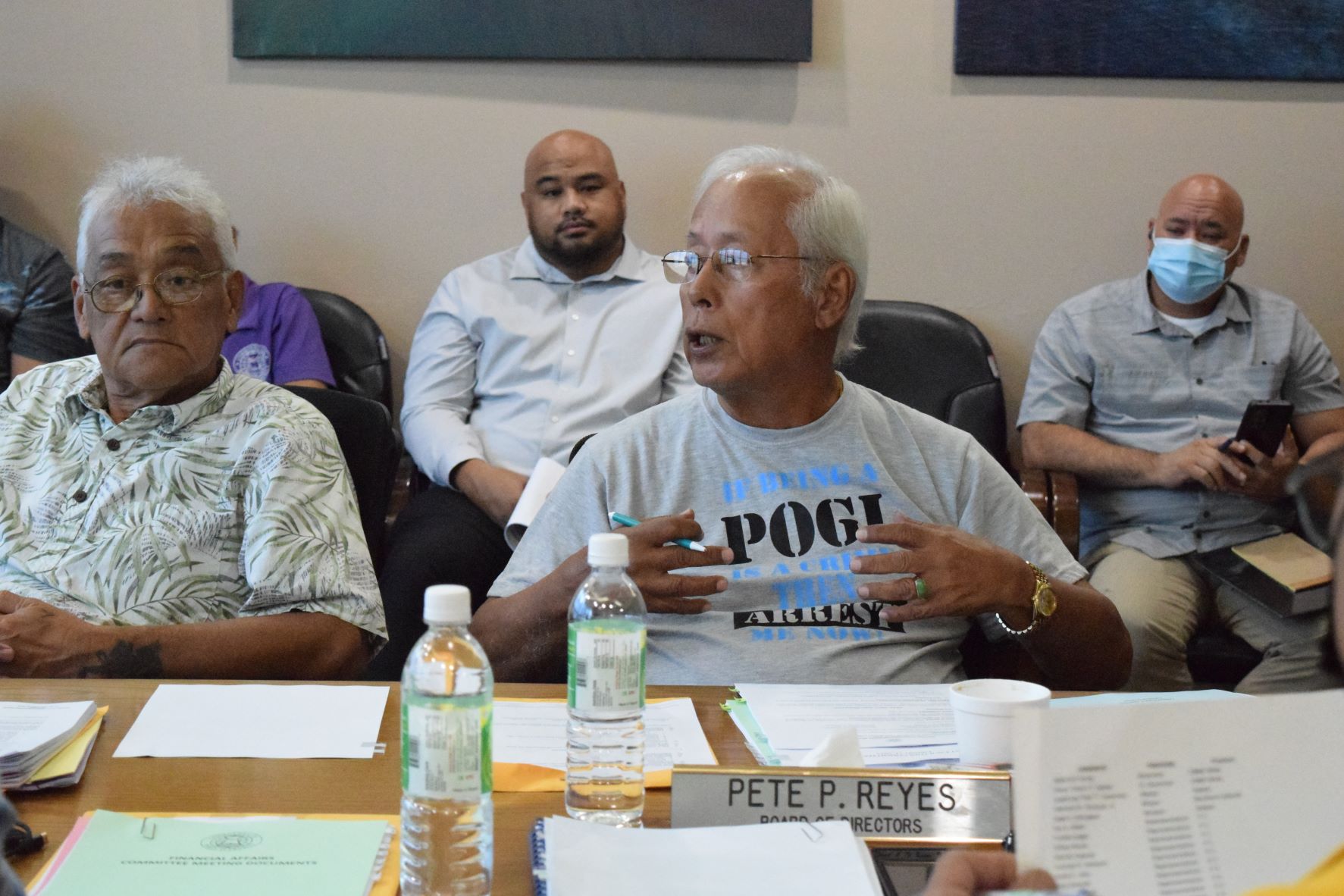 Commonwealth Ports Authority board member, right, speaks as fellow board member Thomas P. Villagomez listens during a CPA board meeting on Thursday last week in the Port of Saipan conference room.