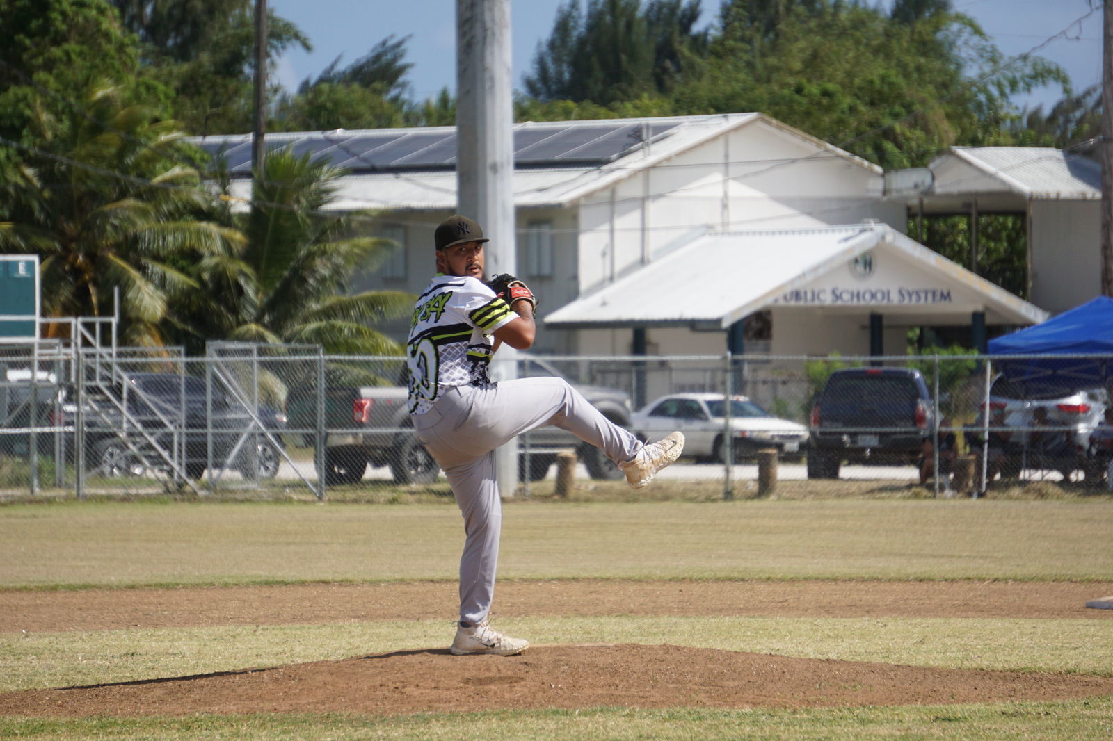 CK Bears pitcher Jeffrey Lizama winds up during the opening game against the Brewers in the Tan Holdings Saipan Baseball League at the Francisco "Tan Ko" Palacios Baseball Field on Saturday.
