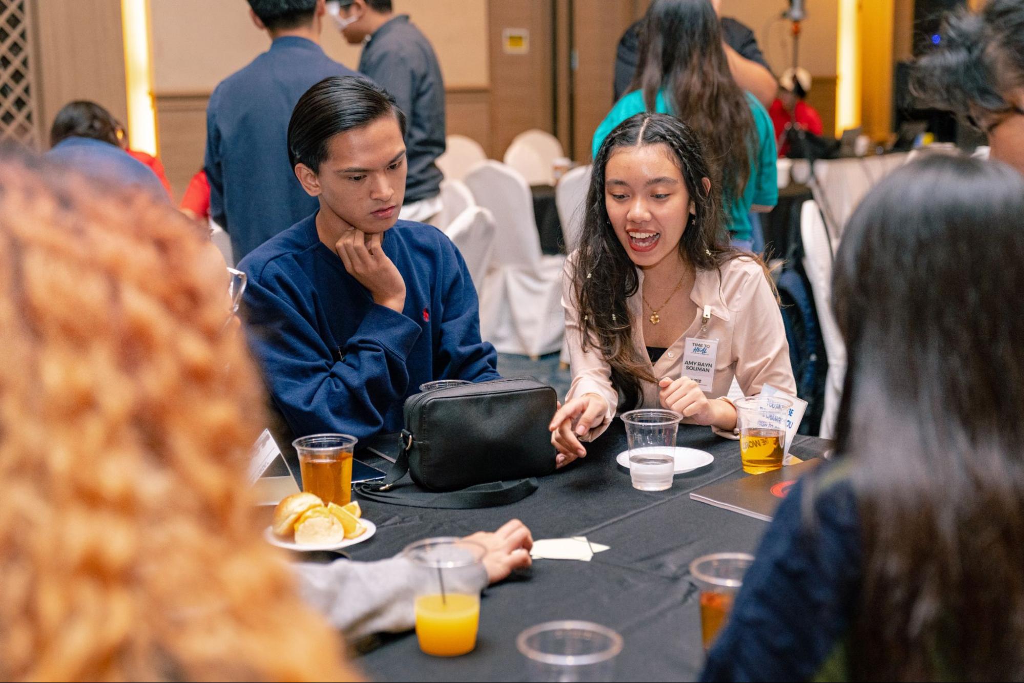 Amy Soliman, a participant of the Time to H.E.A.L mental health summit, takes part in a group activity.