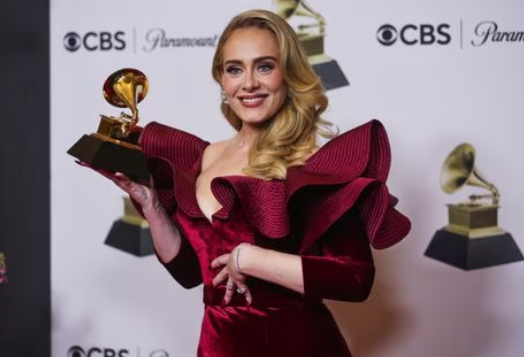 Cap:Adele poses with her Grammy for Best Pop Solo Performance for "Easy On Me" during the 65th Annual Grammy Awards in Los Angeles, California, Feb. 5, 2023.