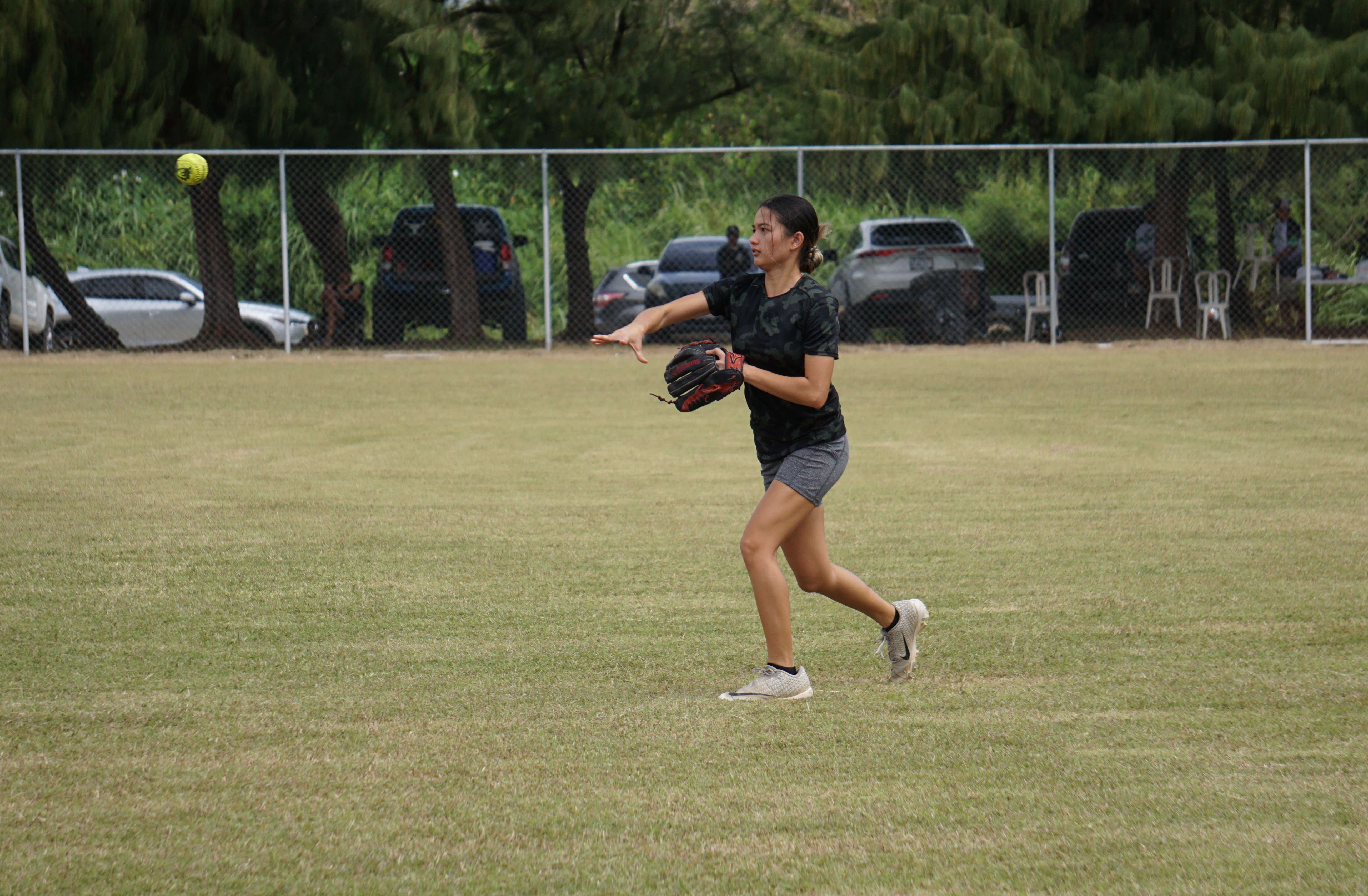 Lady Blue Jay's Kiana Camacho throws infield for the out during a ladies division game of the 2023 Budweiser Belau Amateur Softball League at the Dandan baseball field on Sunday.