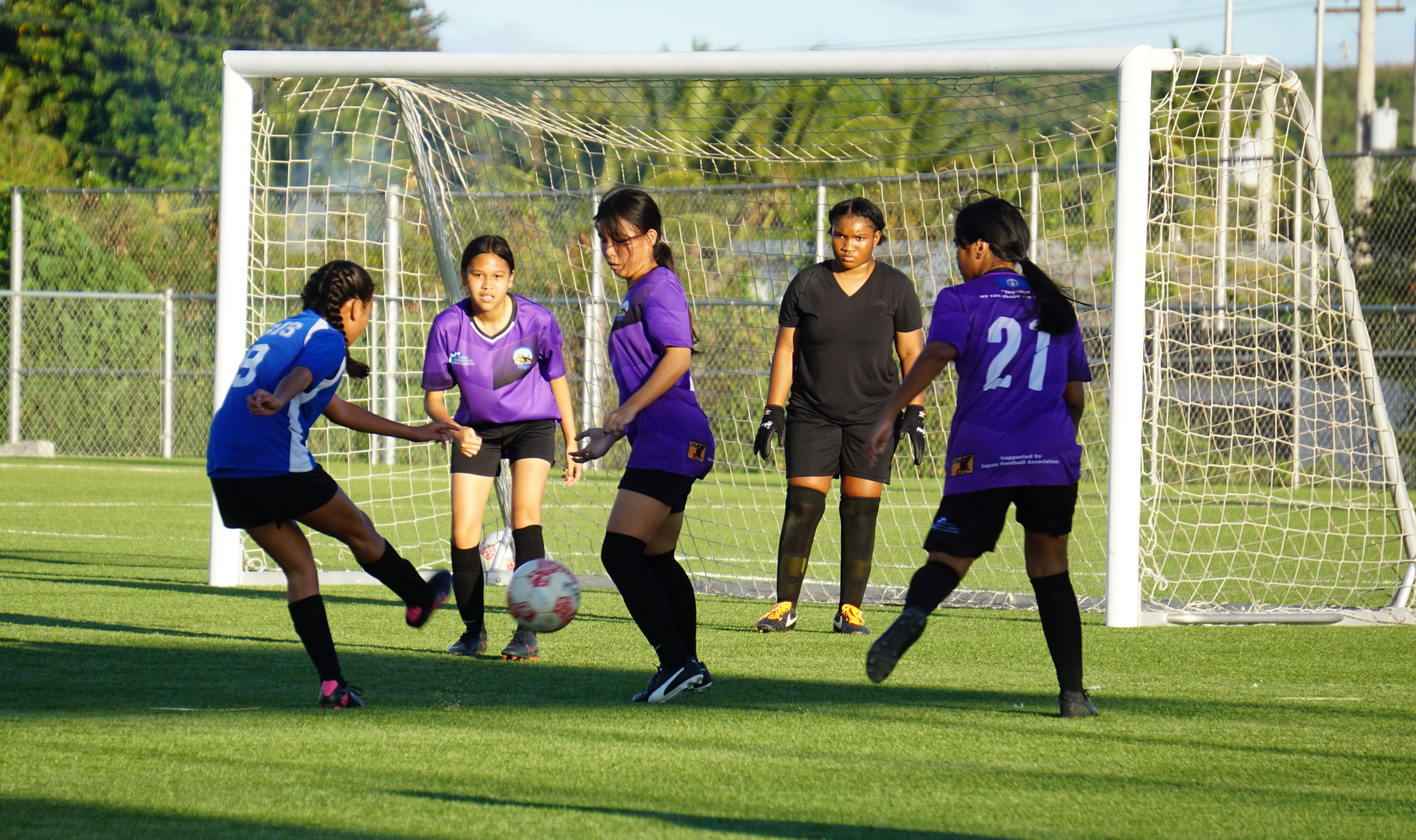 SIS's Aubrey White attempts a shot against four defenders during the championship game in the girls middle school division of the NMIFA-PSS Interscholastic Soccer League on Thursday at the NMI Soccer Training Center in Koblerville.