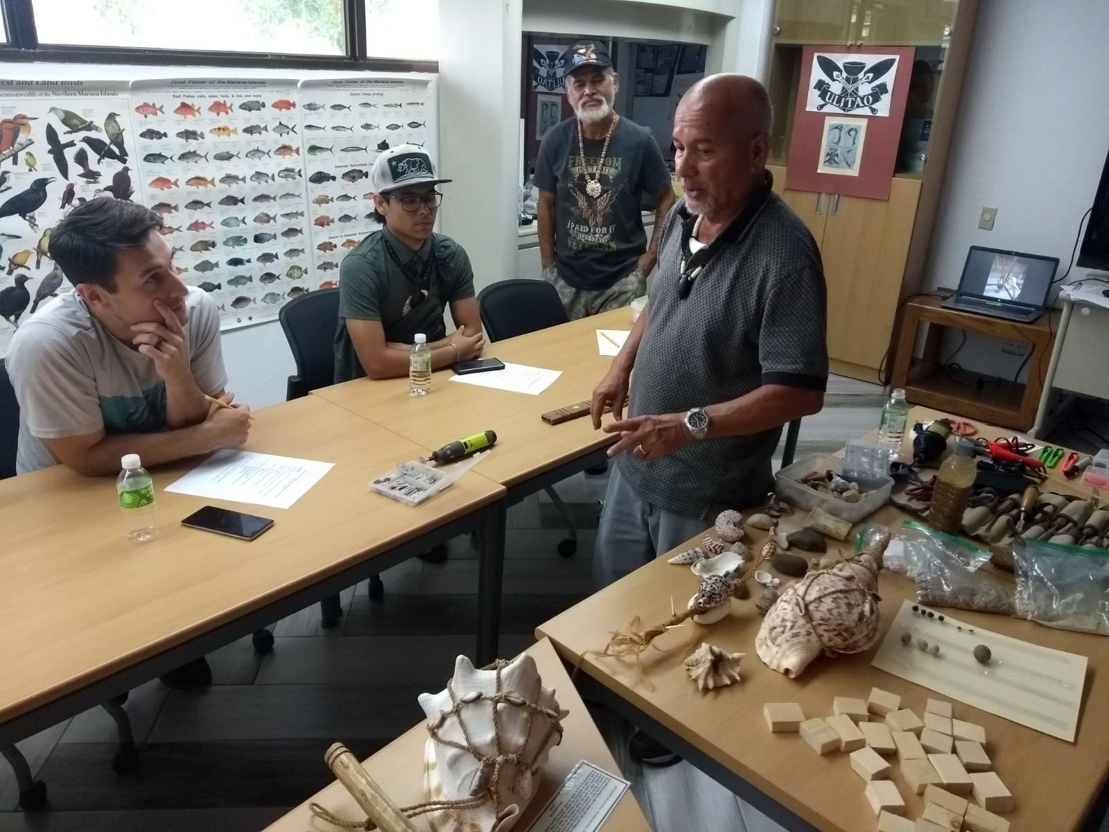 Chamorro historian, experimental archaeologist, and public lecturer Noel Noah Borja Quitugua conducts a class on Chamorro craftsmanship for teens and adults at Joeten-Kiyu Public Library.
