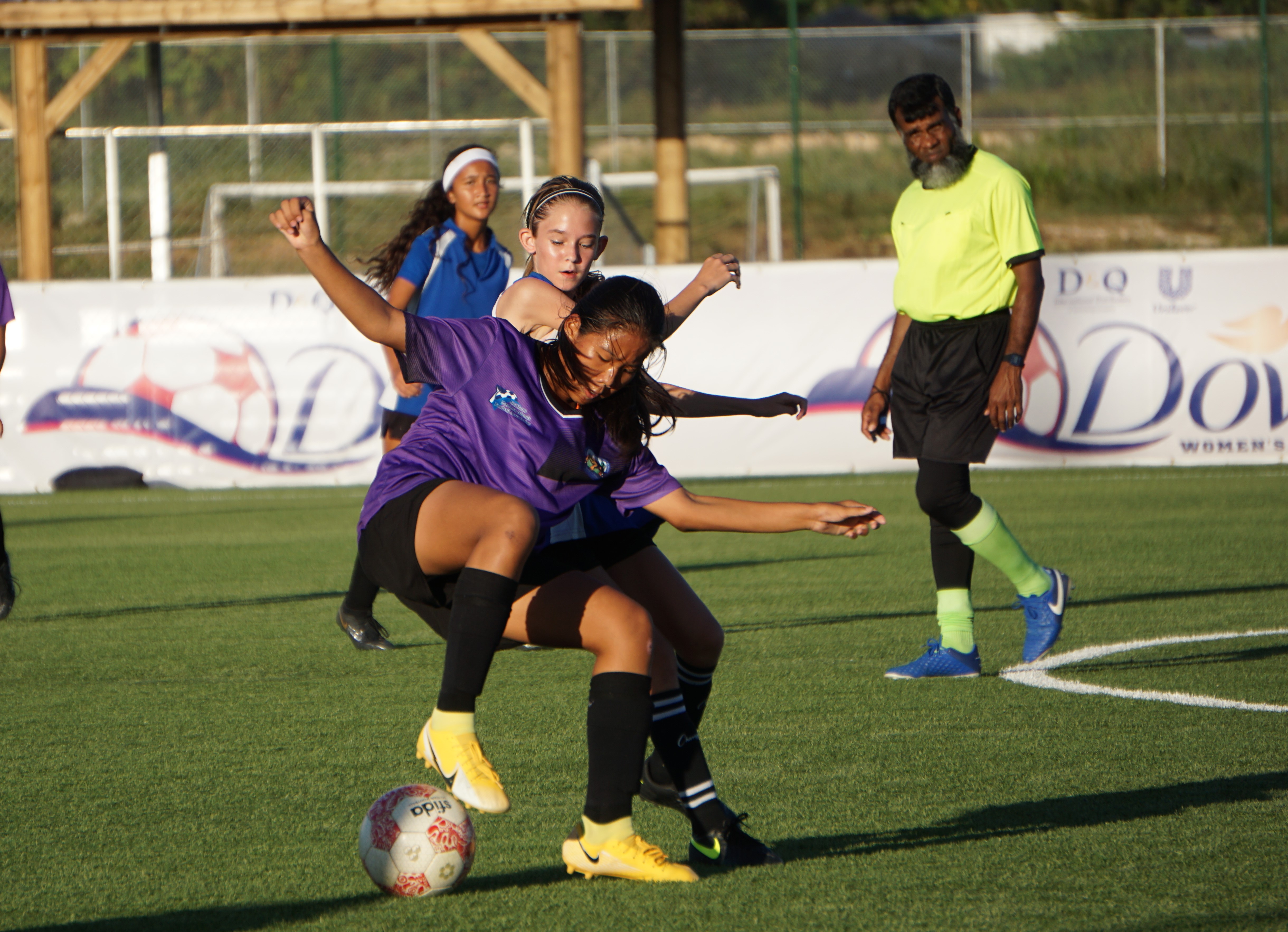 Hopwood’s Yelynn Ha protects the possession as SIS's Eliza Culp closes in during the championship game in the girls middle school division of the NMIFA-PSS Interscholastic Soccer League on Thursday at the NMI Soccer Training Center in Koblerville.