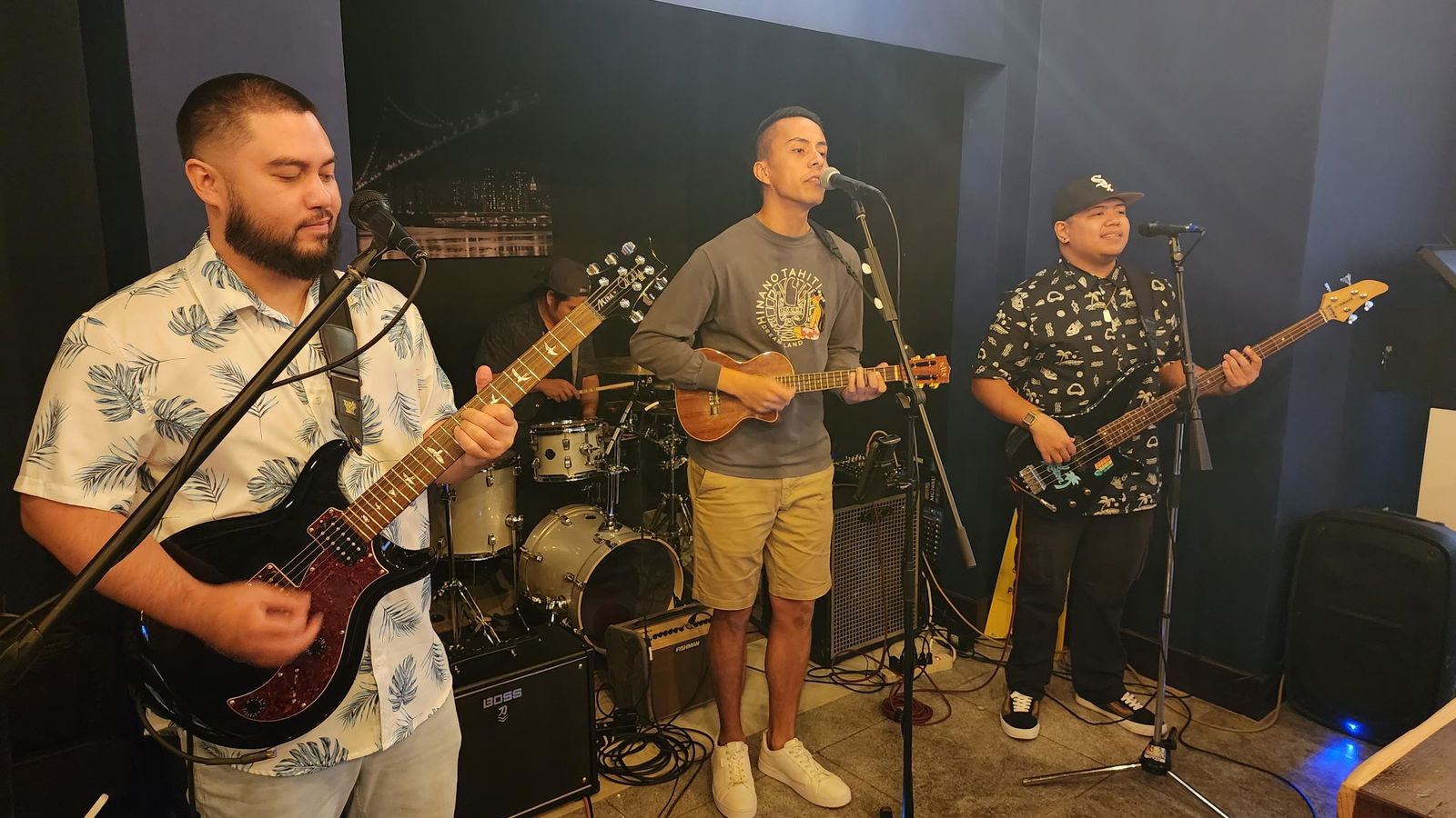 Local artists perform during Tapped Out's  grand opening on Saturday.