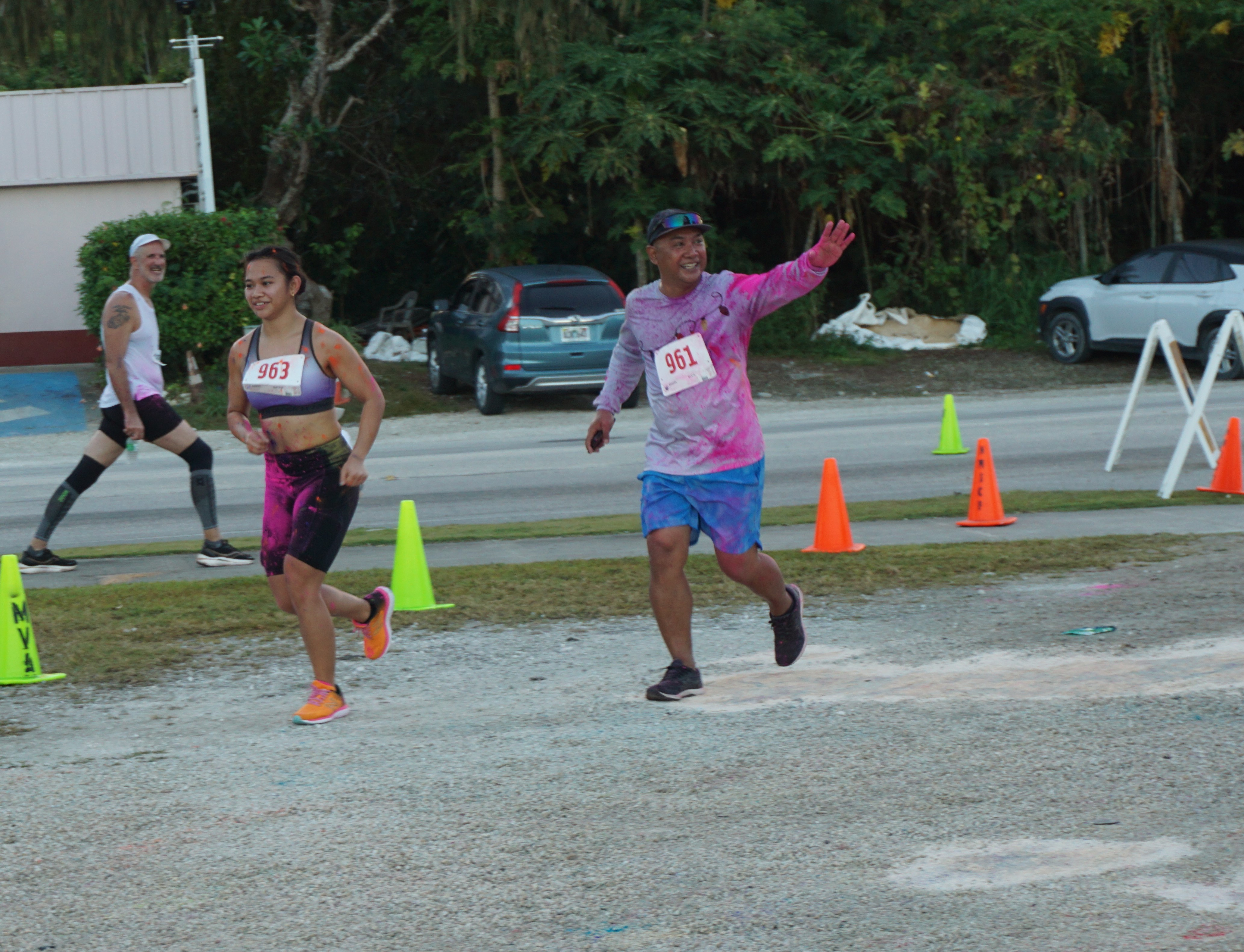 Robin Sapong and daughter Zarinae approach the finish line.