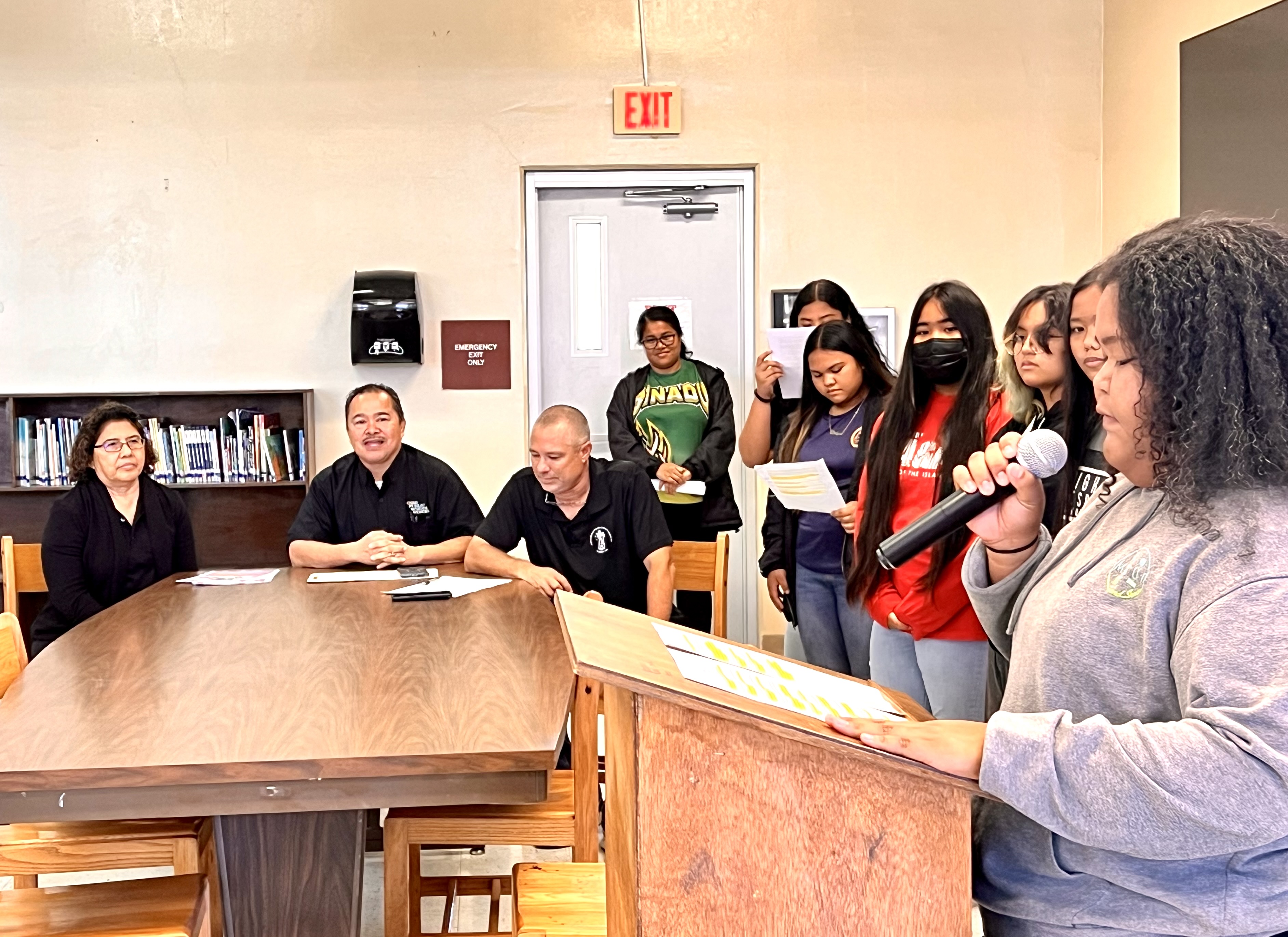 Chacha Ocean View Middle School students take turns in reading the School Library Month proclamation.