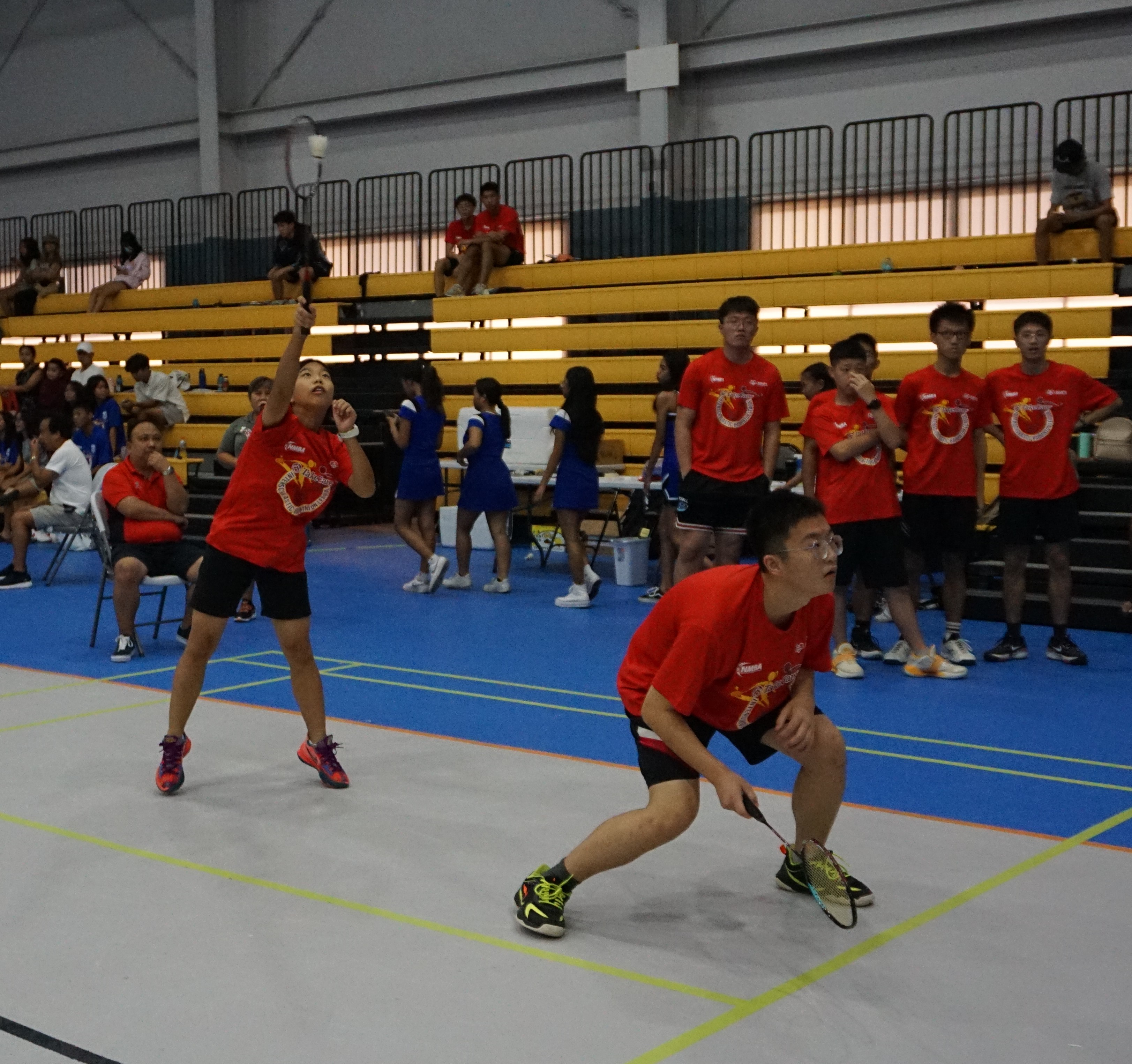 An ACS player extends for the smash return during a mixed doubles event of the TakeCare-PSS Interscholastic Badminton League at the Ada gym.